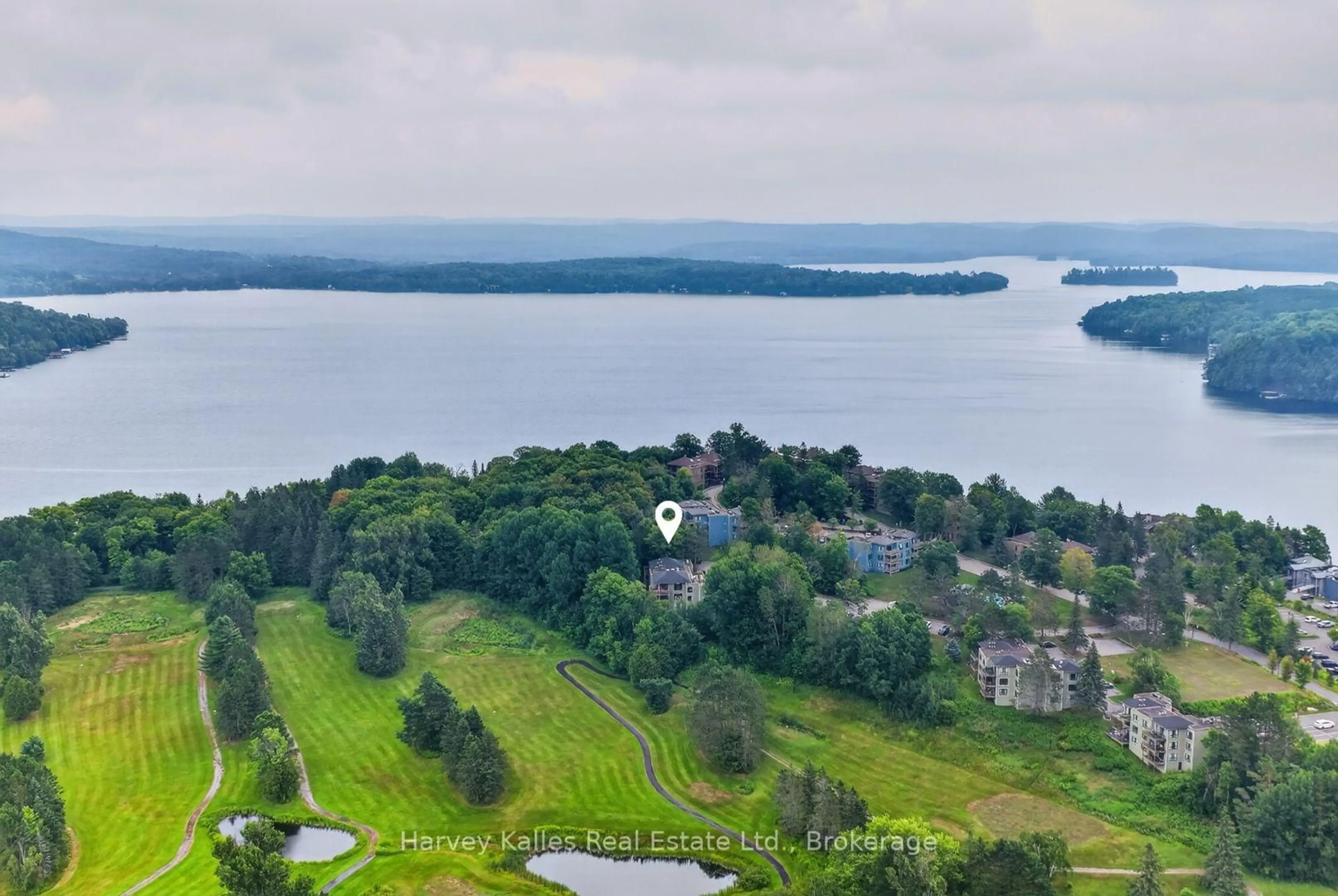 A pic from outside/outdoor area/front of a property/back of a property/a pic from drone, water/lake/river/ocean view for 26 Deerhurst Golfview Dr #303, Huntsville Ontario P1H 1A9