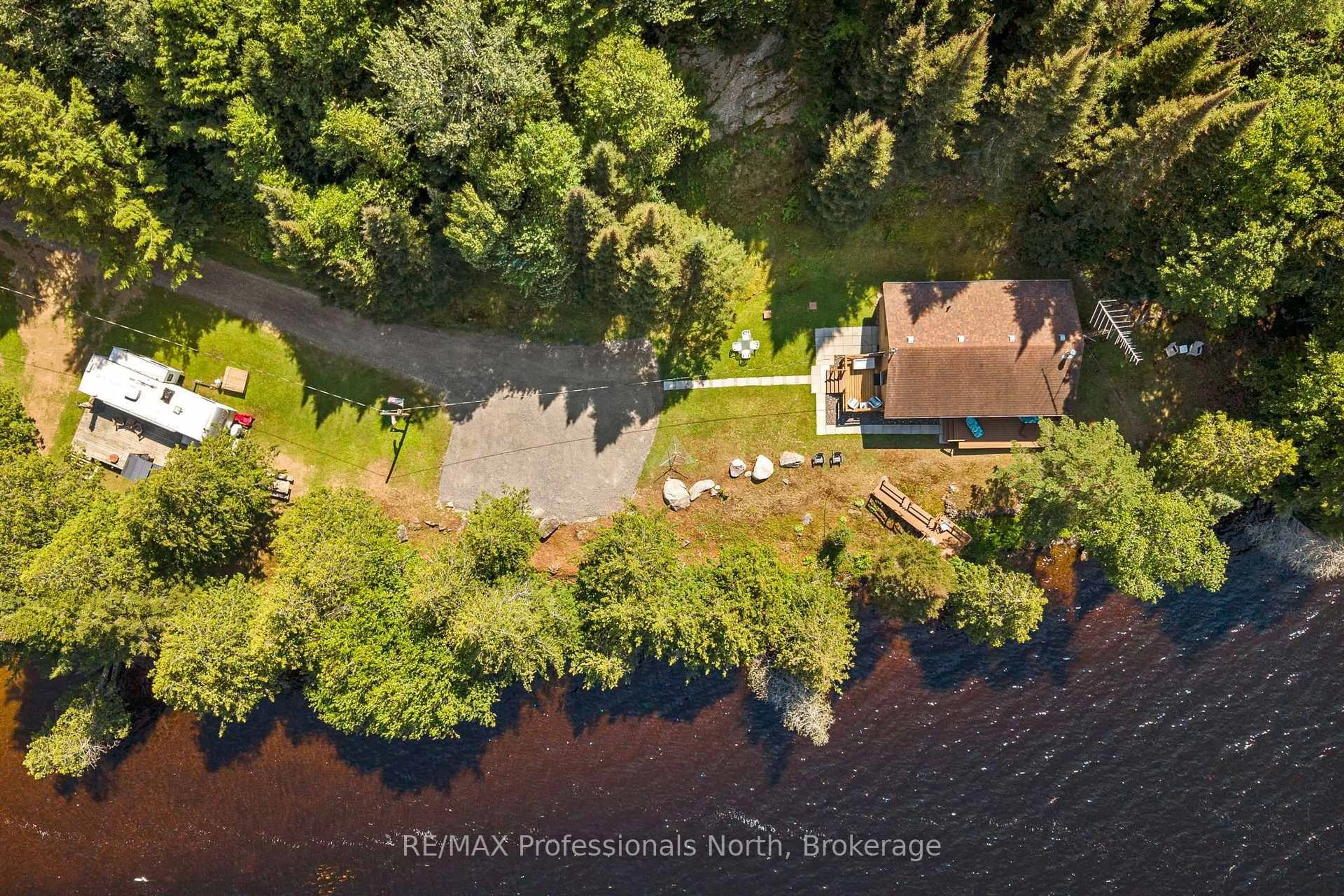 A pic from outside/outdoor area/front of a property/back of a property/a pic from drone, water/lake/river/ocean view for 1516 Deer Lake Rd, Perry Ontario P0A 1J0