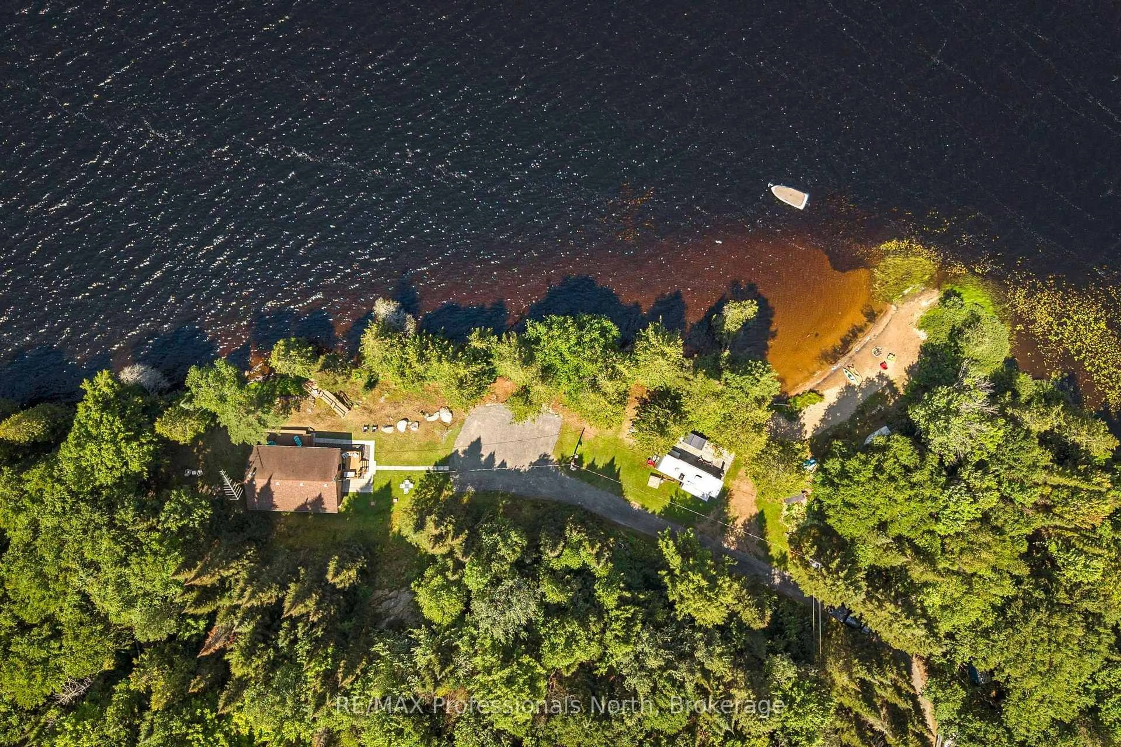 A pic from outside/outdoor area/front of a property/back of a property/a pic from drone, water/lake/river/ocean view for 1516 Deer Lake Rd, Perry Ontario P0A 1J0