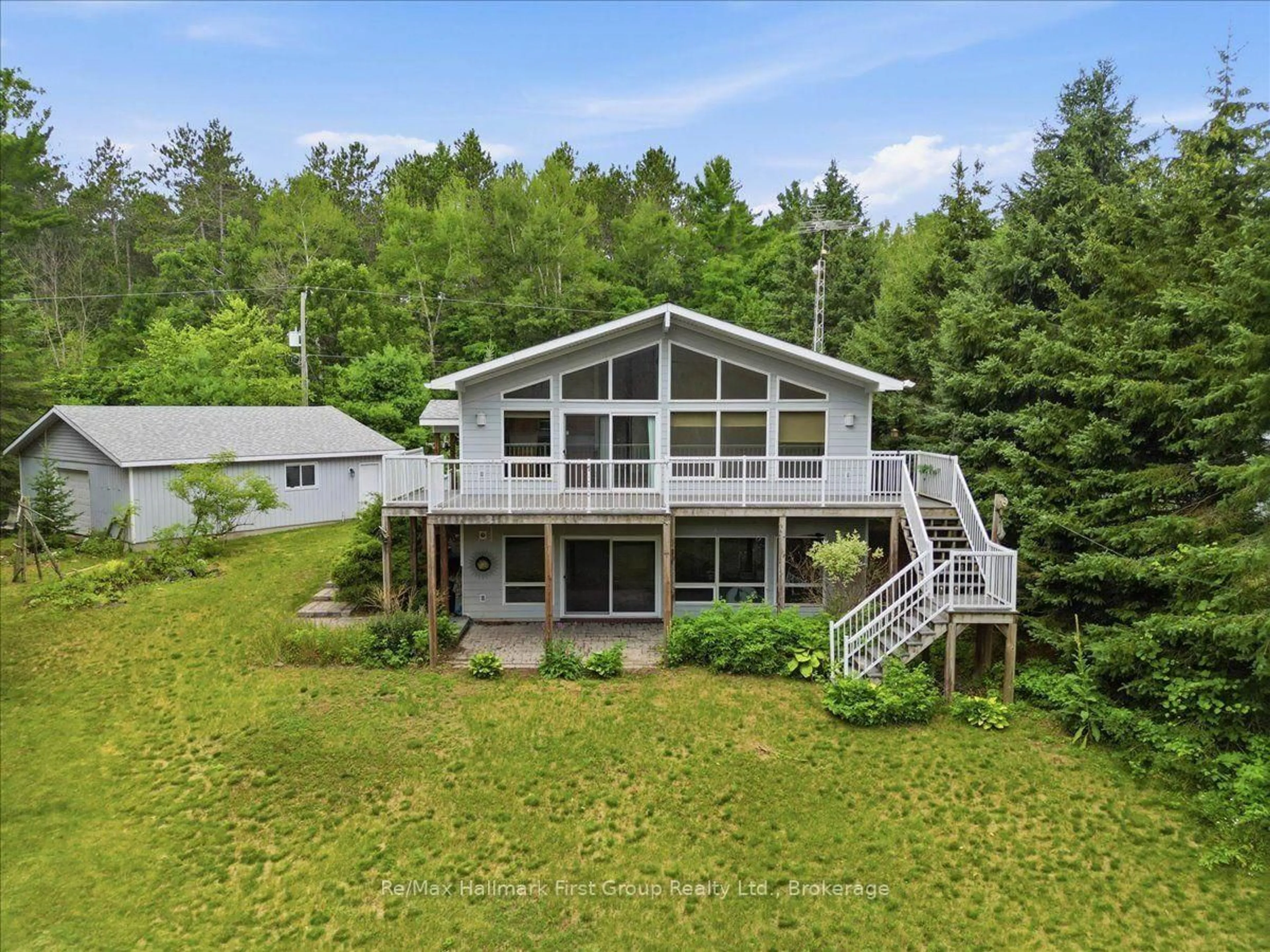 A pic from outside/outdoor area/front of a property/back of a property/a pic from drone, water/lake/river/ocean view for 32 Skootamatta Lane, Tweed Ontario K0K 3J0