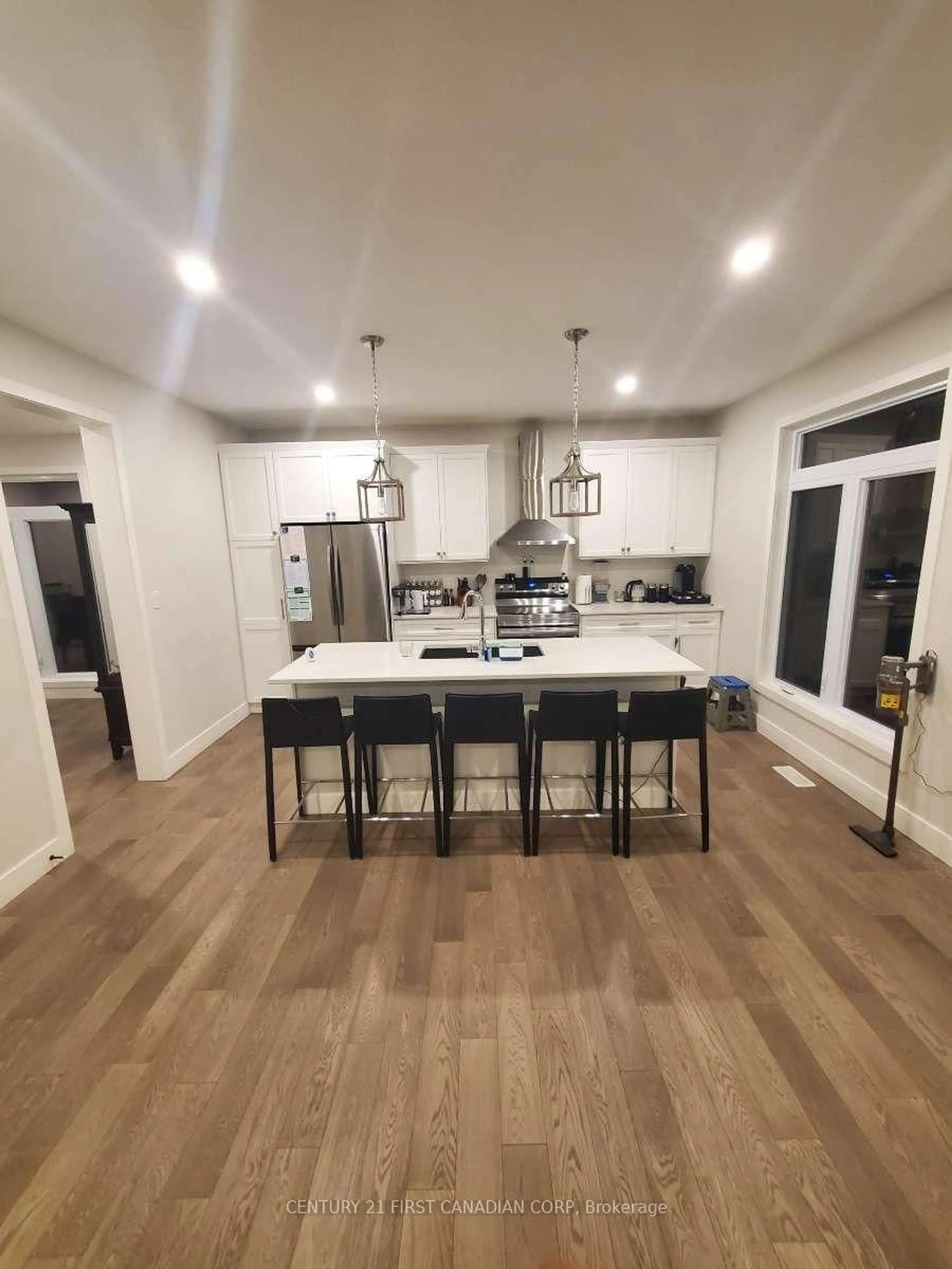 Open concept kitchen, wood/laminate floor for 44 Kelly Dr, Zorra Ontario N0M 2M0