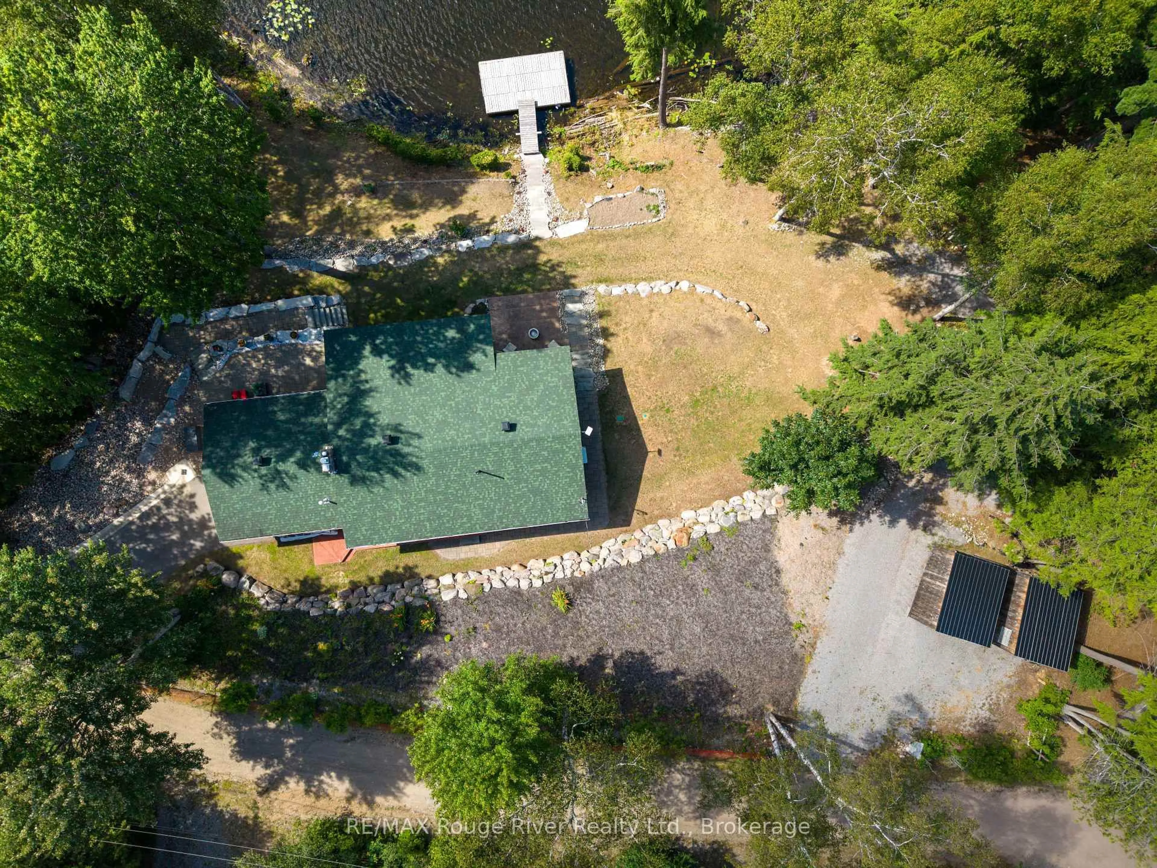 A pic from outside/outdoor area/front of a property/back of a property/a pic from drone, forest/trees view for 1087 Lagoon Rd, Highlands East Ontario K0L 1C0