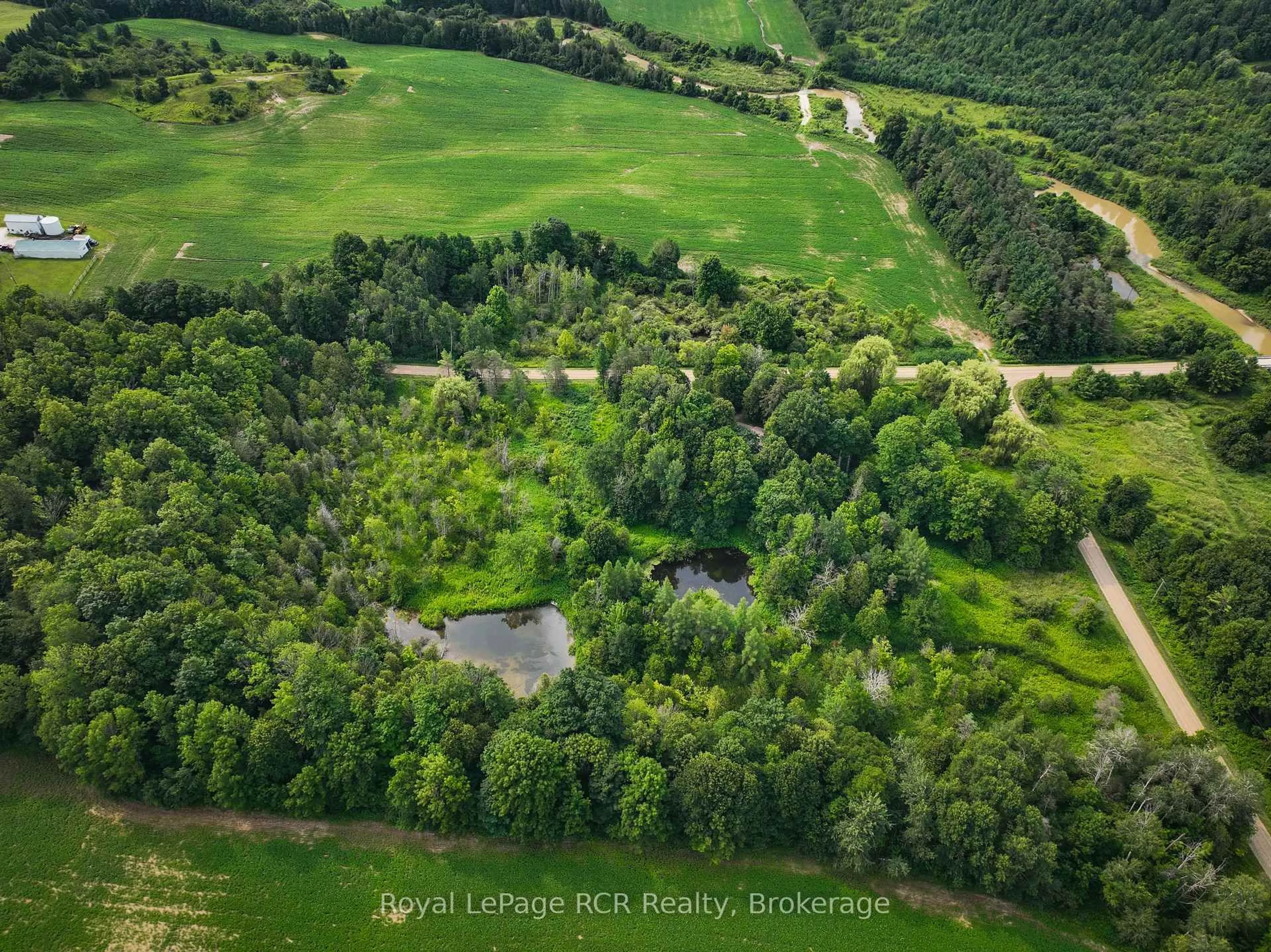 A pic from outside/outdoor area/front of a property/back of a property/a pic from drone, forest/trees view for 984 14 Concession, Brockton Ontario N0G 1L0