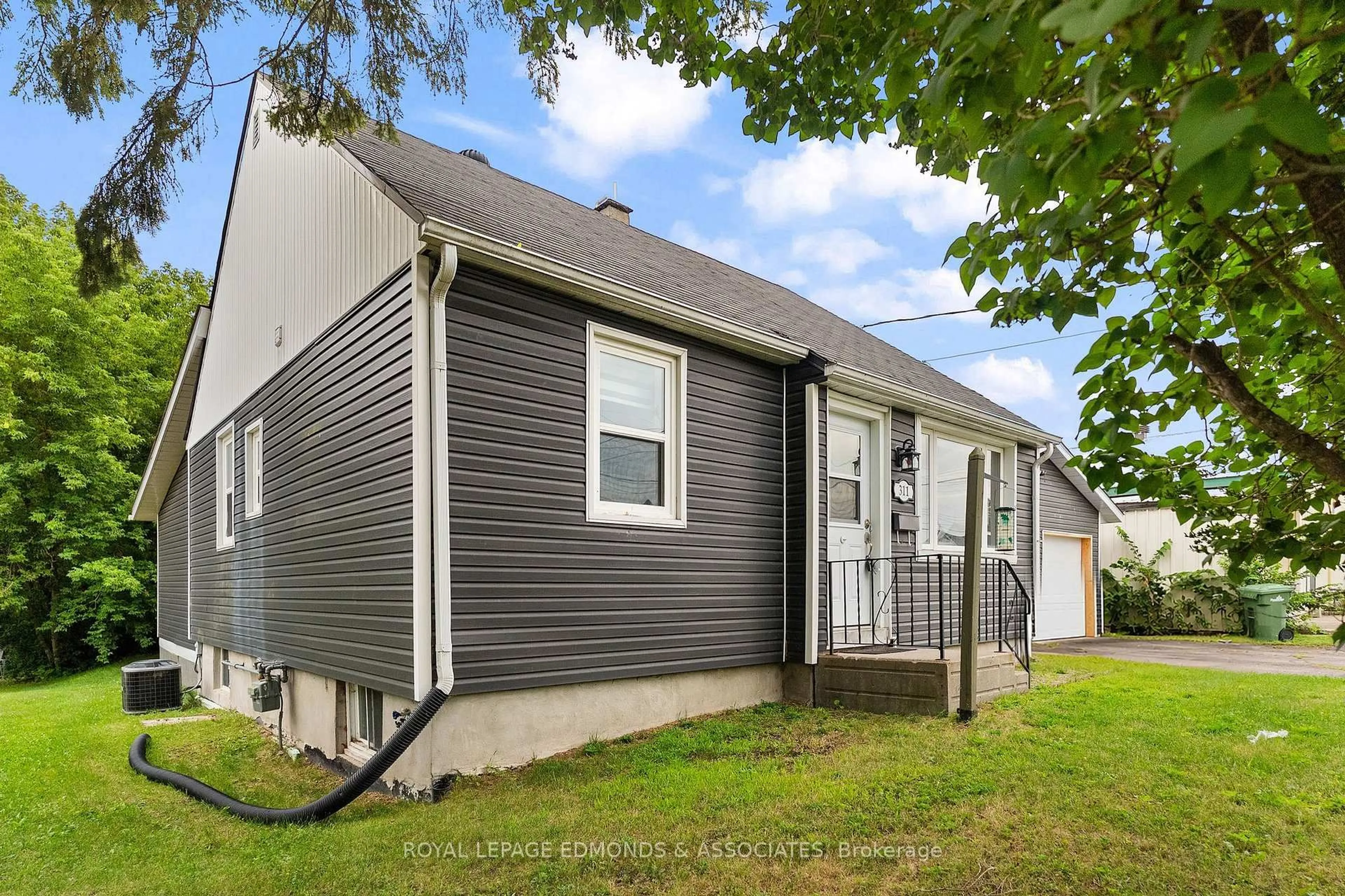 Home with vinyl exterior material, street for 311 Julien St, Pembroke Ontario K8A 3P6
