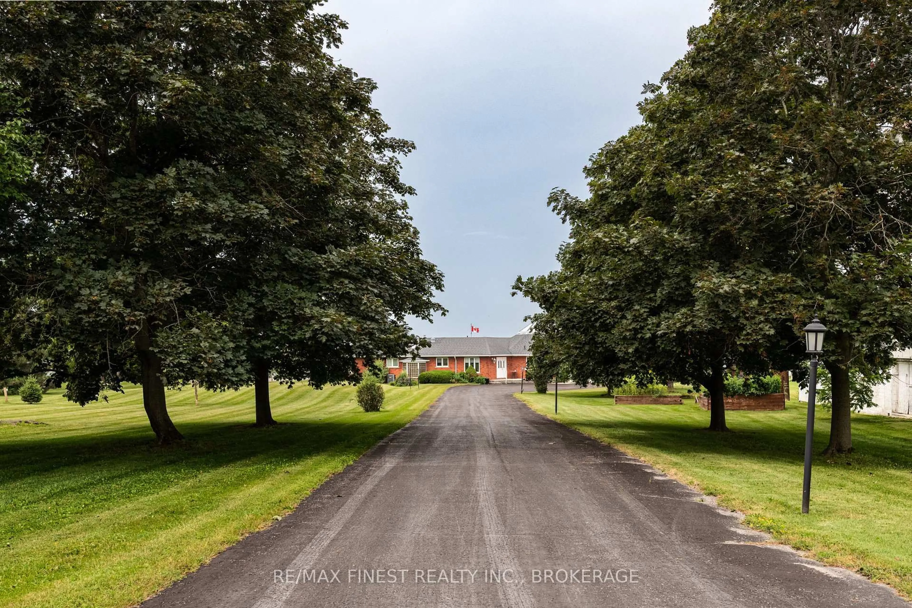 A pic from outside/outdoor area/front of a property/back of a property/a pic from drone, street for 32 Howe Island Dr, Gananoque Ontario K7G 2V6