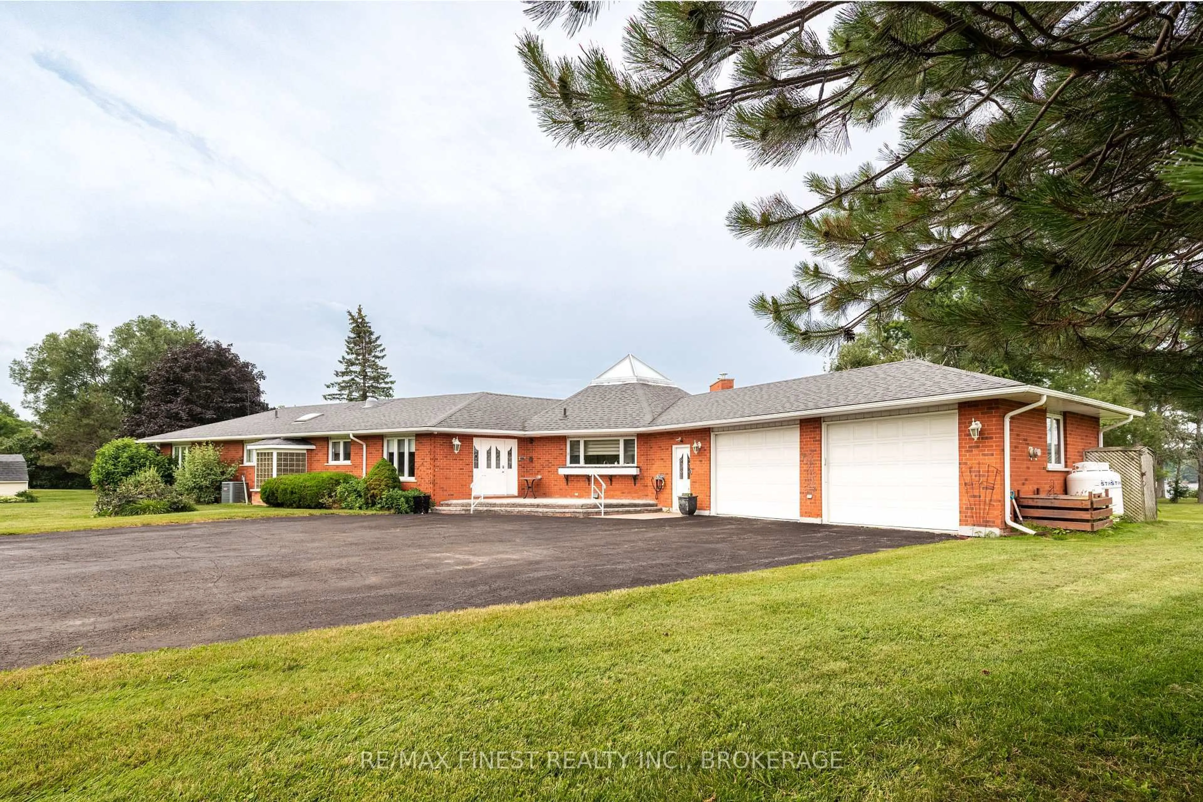 A pic from outside/outdoor area/front of a property/back of a property/a pic from drone, street for 32 Howe Island Dr, Gananoque Ontario K7G 2V6