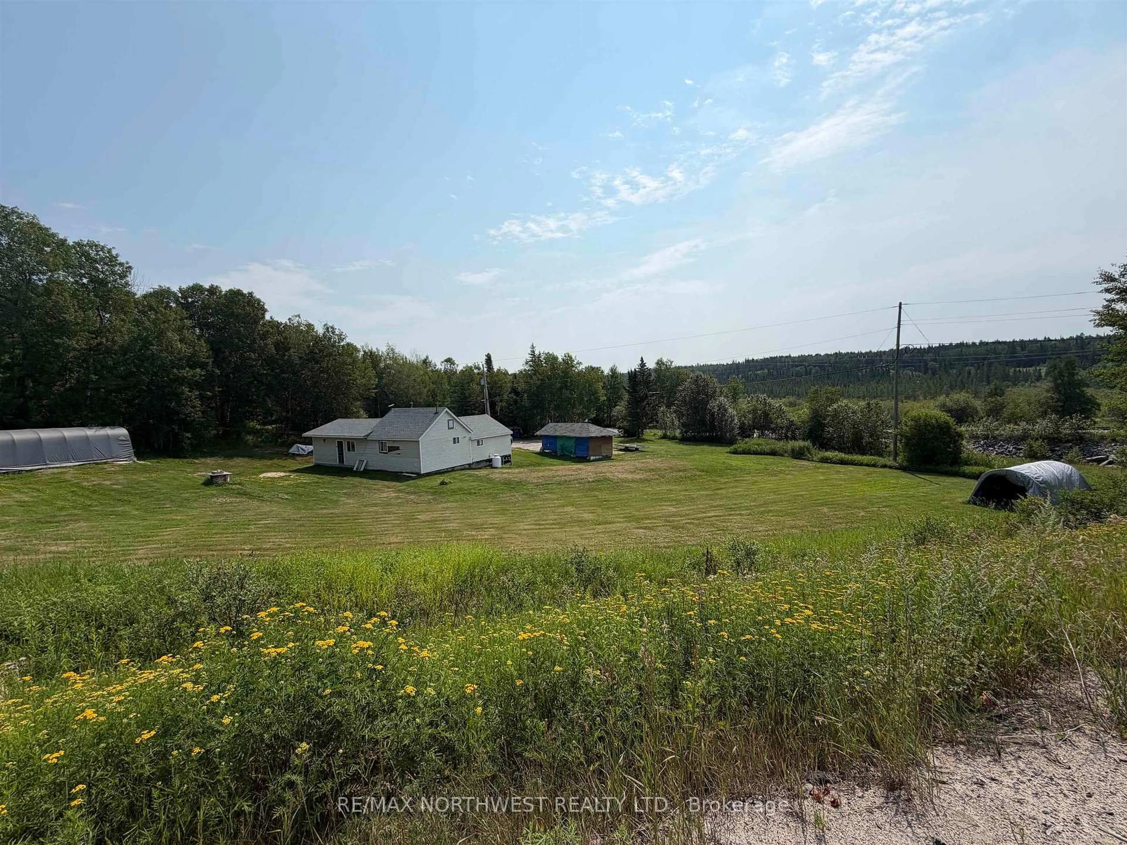 A pic from outside/outdoor area/front of a property/back of a property/a pic from drone, forest/trees view for 16 James Road, Kenora Ontario P9N 0E2