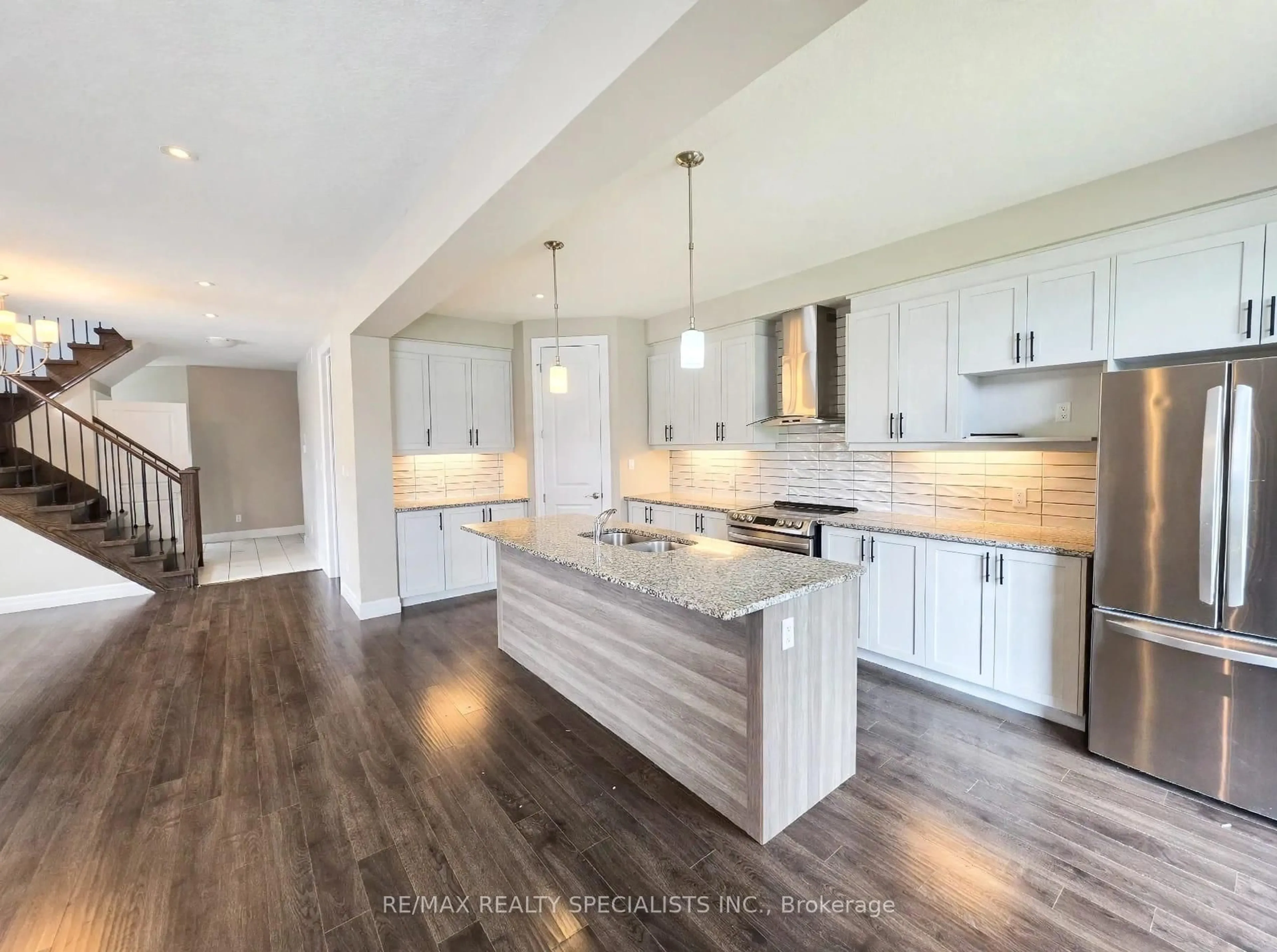 Open concept kitchen, wood/laminate floor for 3074 Turner Cres, London South Ontario N6M 0B2