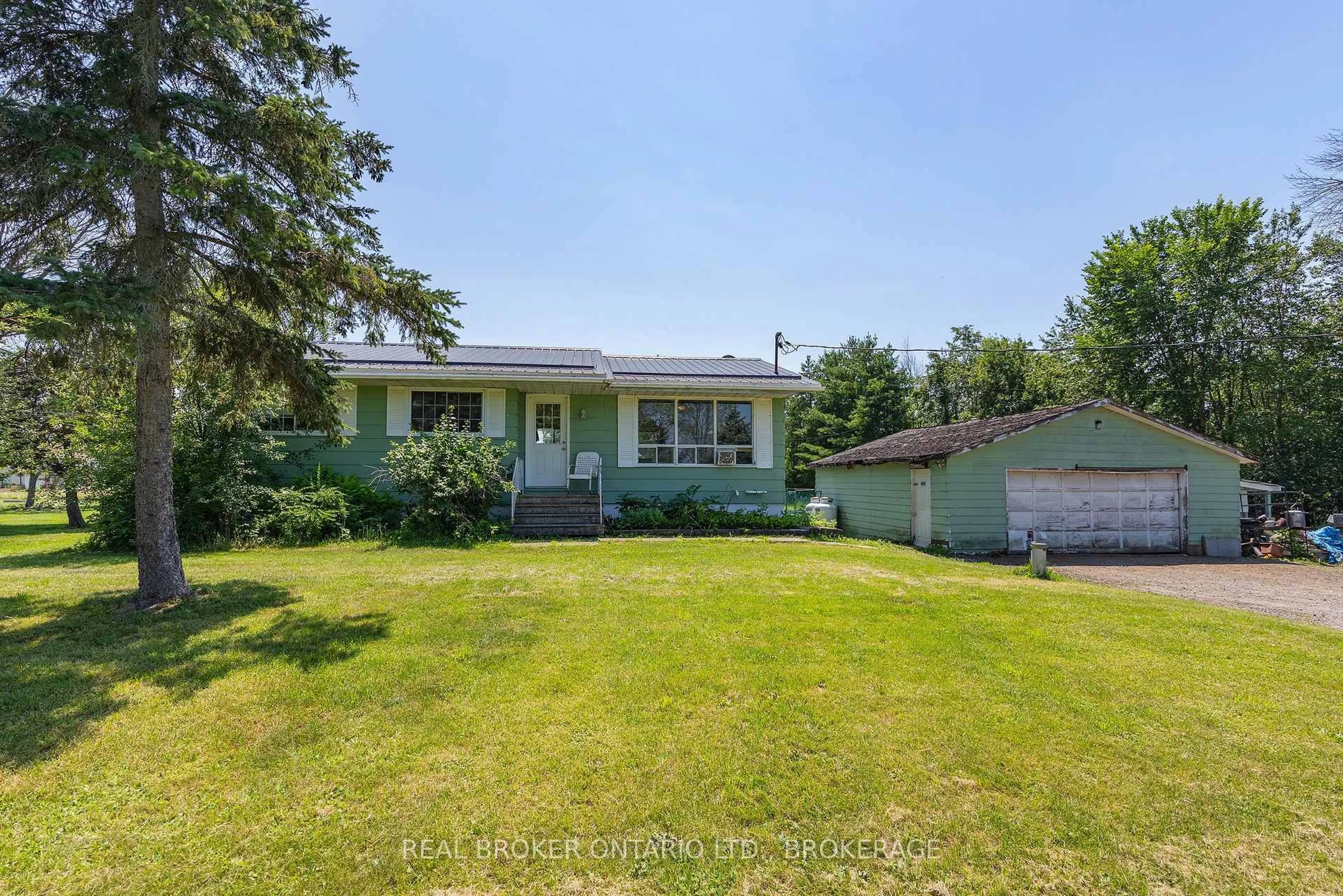 A pic from outside/outdoor area/front of a property/back of a property/a pic from drone, street for 1013 River Rd, Harrowsmith Ontario K0H 1V0