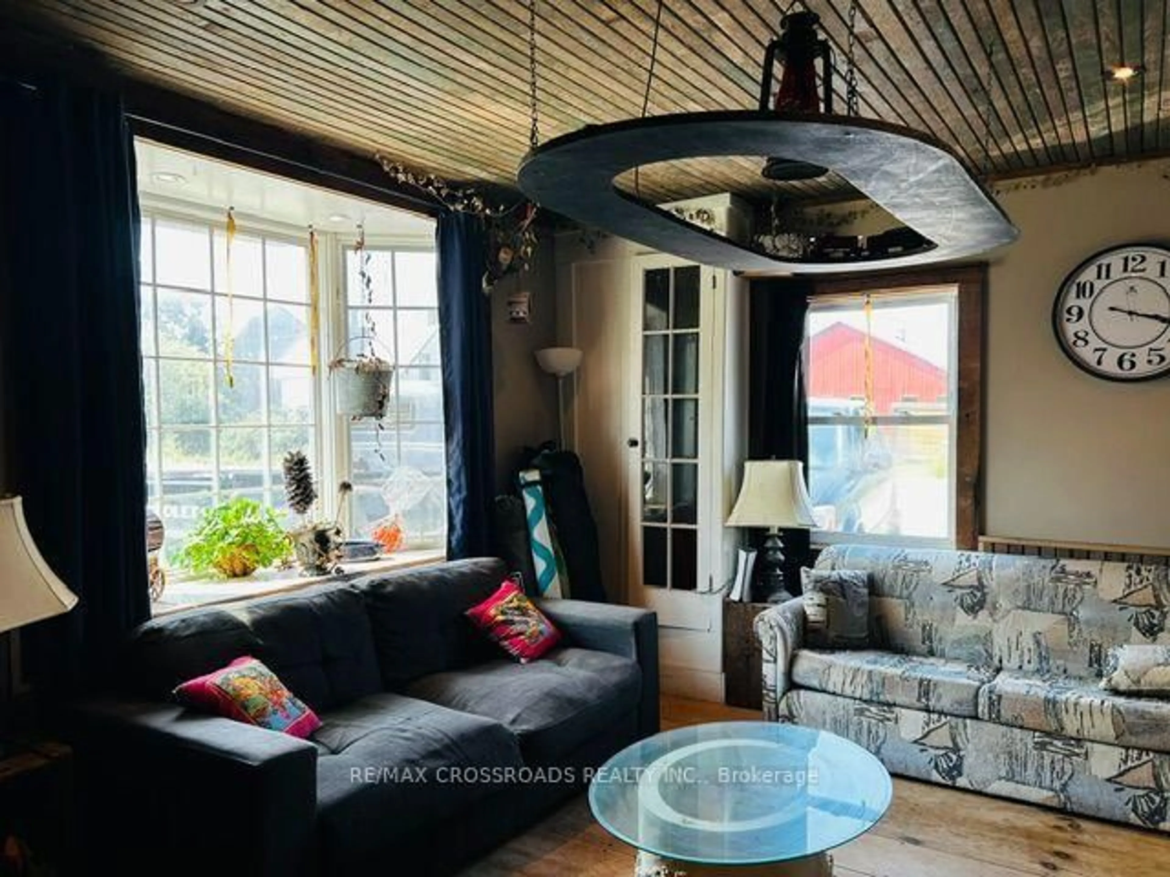 Living room with furniture, wood/laminate floor for 498 Eldon Station Rd, Kawartha Lakes Ontario K0M 2T0