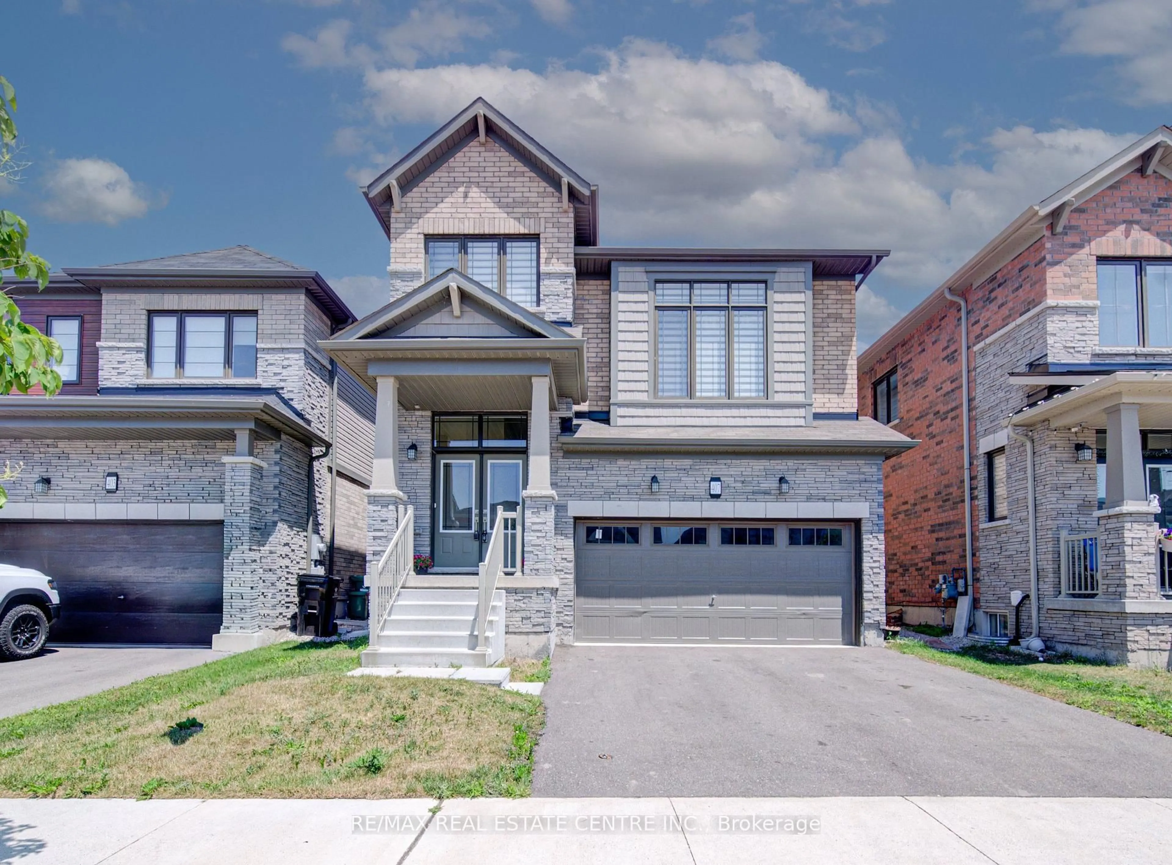 Home with brick exterior material, street for 407 Dolman St, Woolwich Ontario N0B 1M0