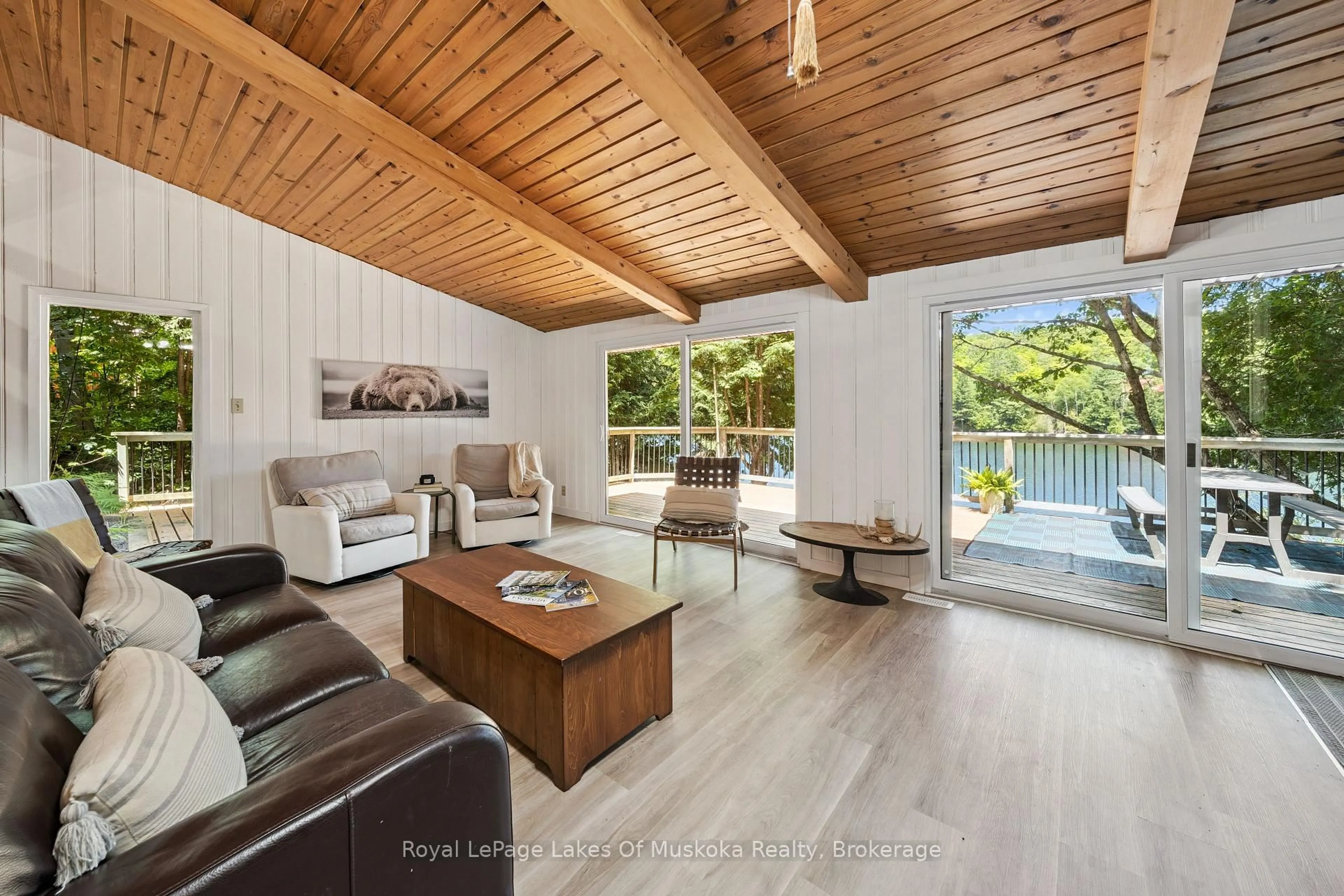 Living room with furniture, wood/laminate floor for 1345 Sinclair T Kawagama Lake Tr, Algonquin Highlands Ontario P0A 1E0