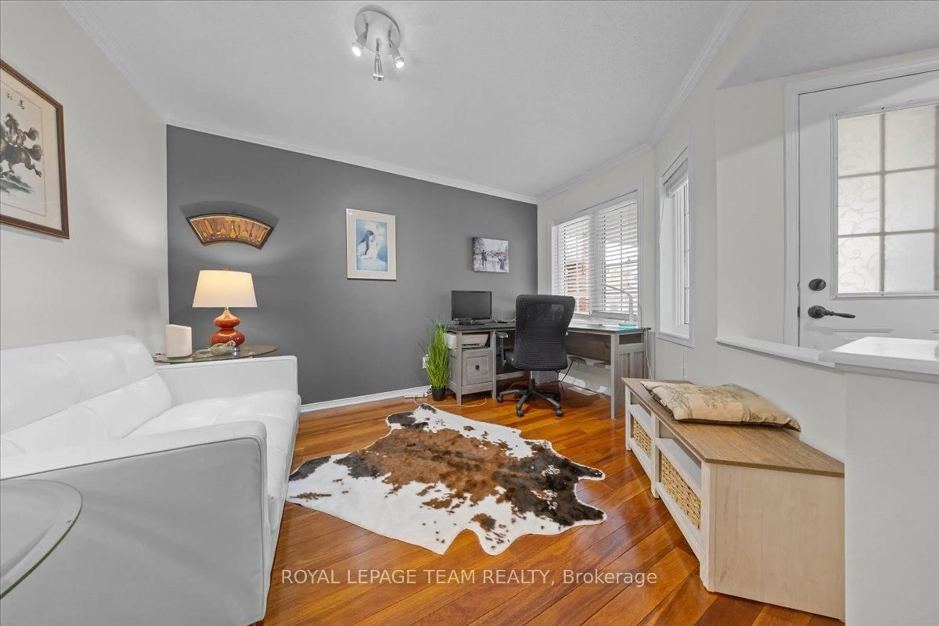 Living room with furniture, wood/laminate floor for 115 Fairlop Way, Ottawa Ontario K2J 5B6