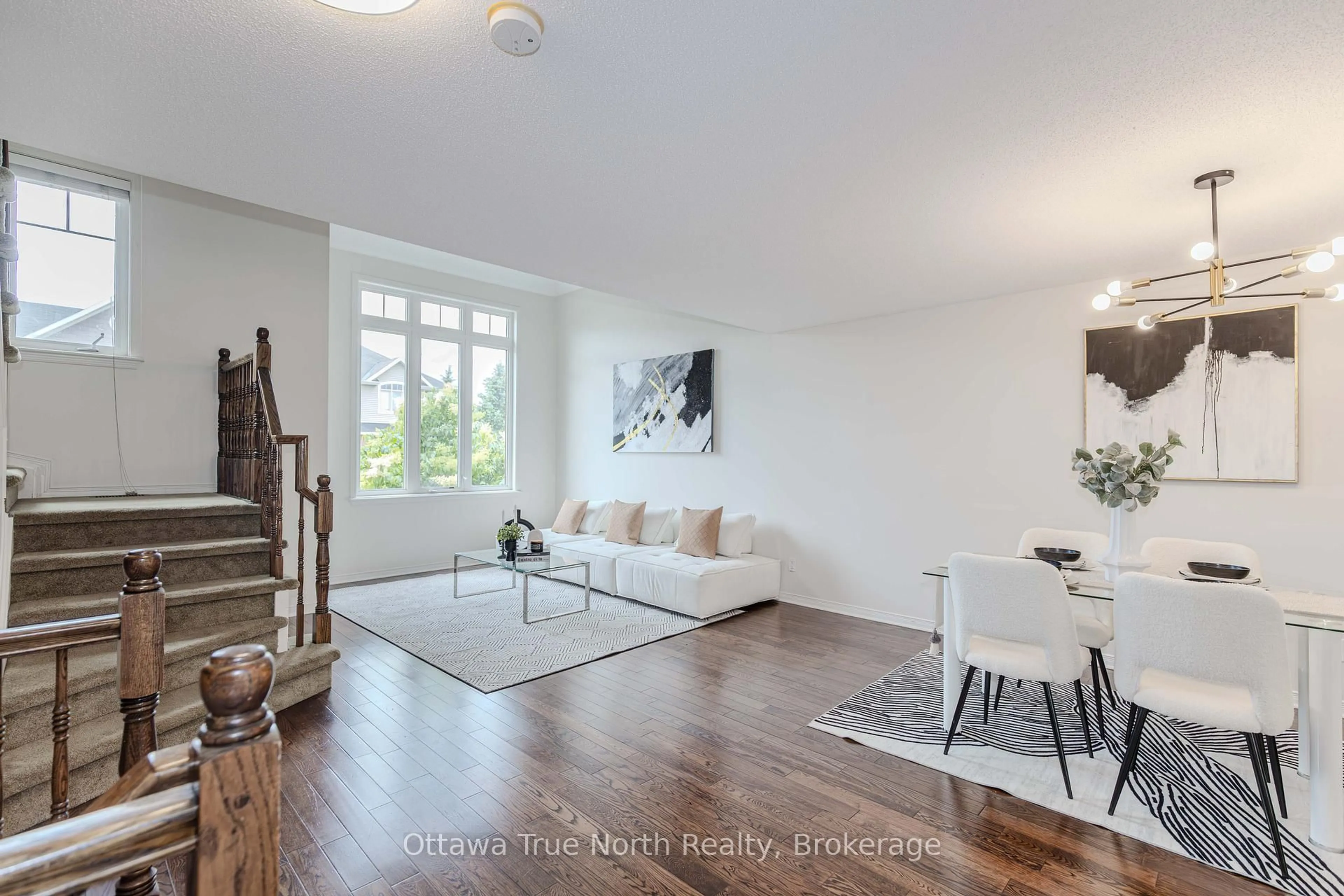 Living room with furniture, wood/laminate floor for 276 Keltie Private #9, Ottawa Ontario K2J 0A4