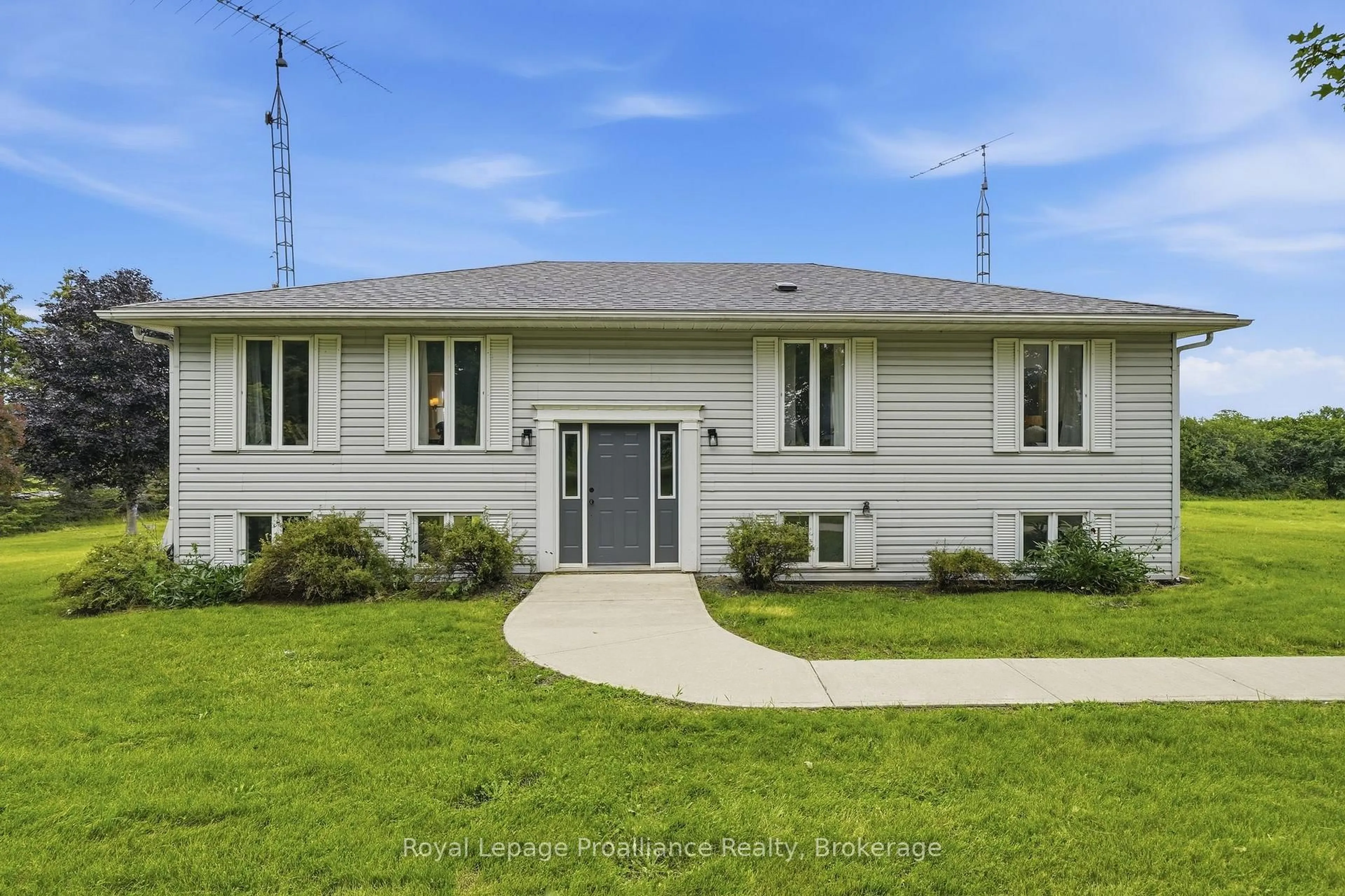 Home with vinyl exterior material, street for 509 Kelly Rd, Prince Edward County Ontario K0K 1P0