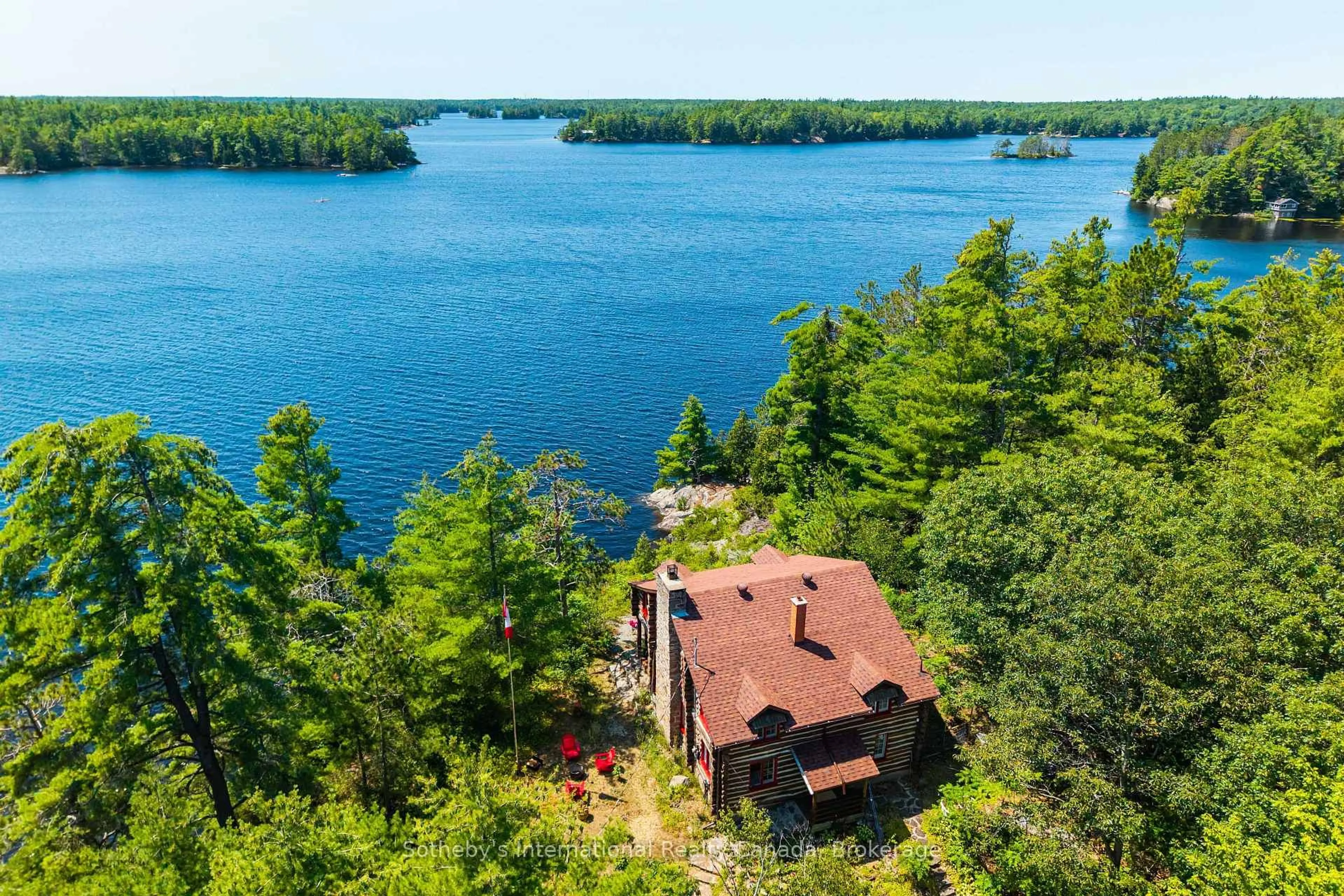 A pic from outside/outdoor area/front of a property/back of a property/a pic from drone, water/lake/river/ocean view for 1 Island 29kl Kahshe Lake - Cooee Island, Gravenhurst Ontario P0E 1G0