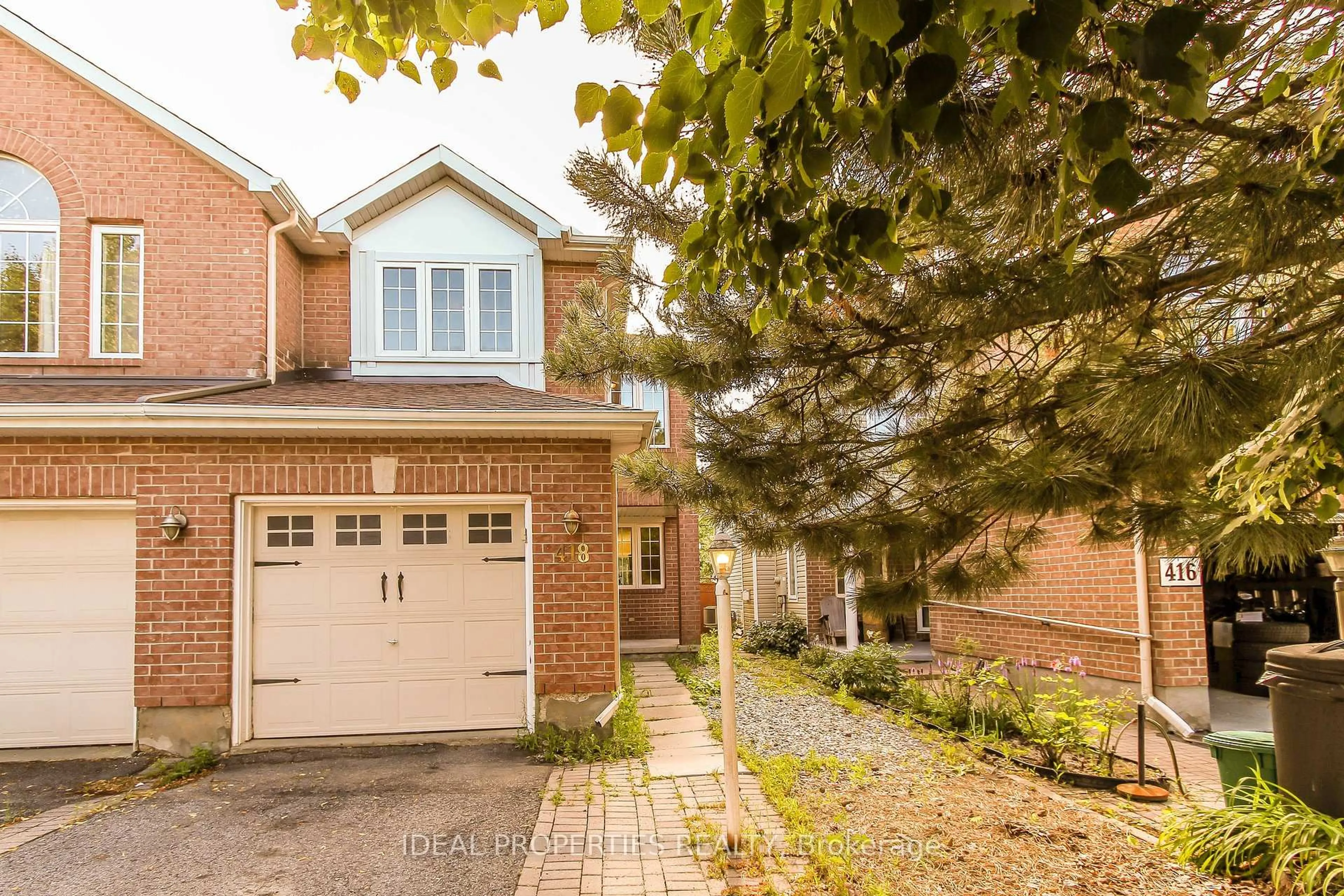 Home with brick exterior material, street for 418 Beatrice Dr, Ottawa Ontario K2J 4W9
