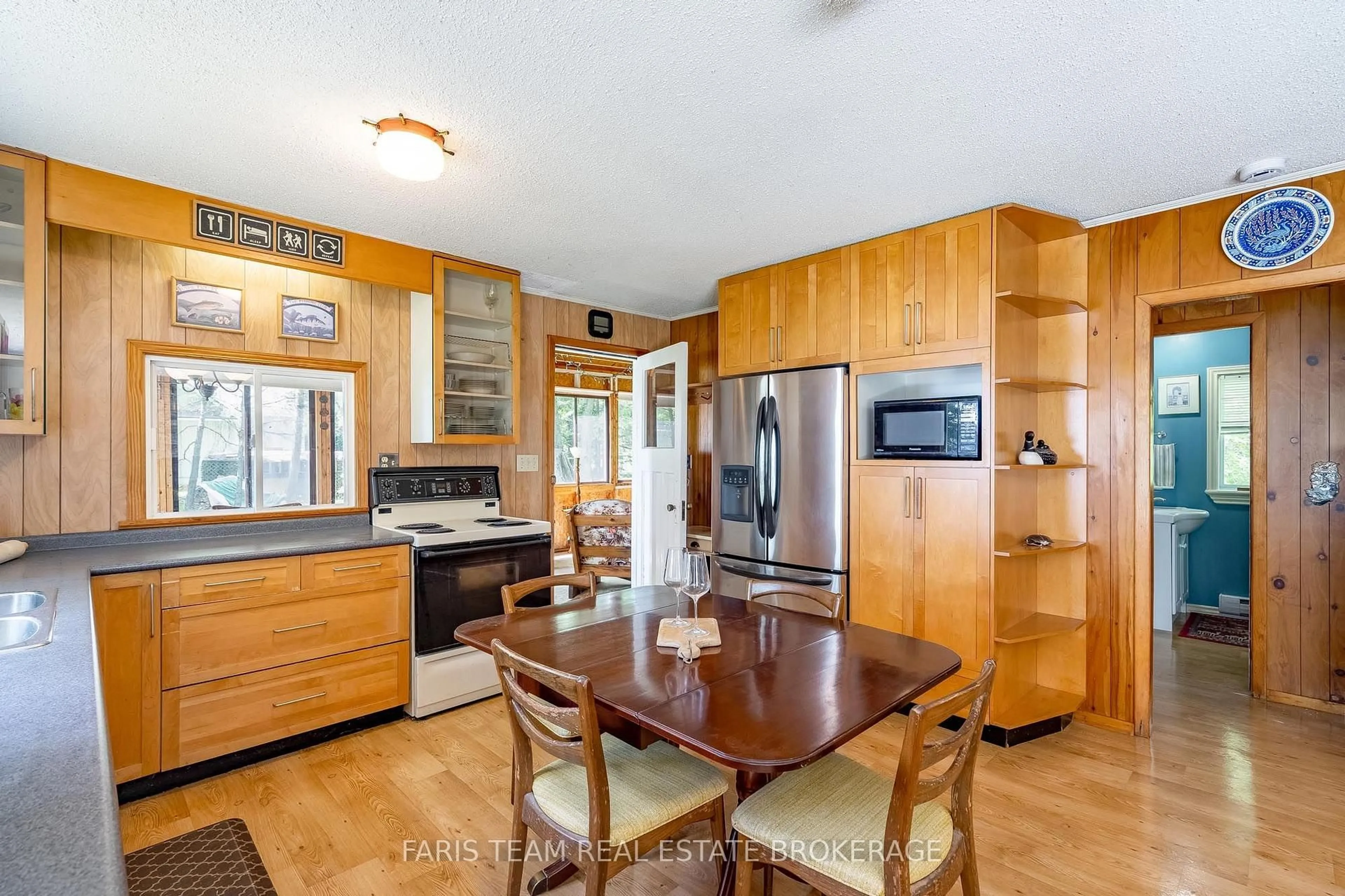 Open concept kitchen, wood/laminate floor for 98 McLeish Dr, Kawartha Lakes Ontario L0K 1W0