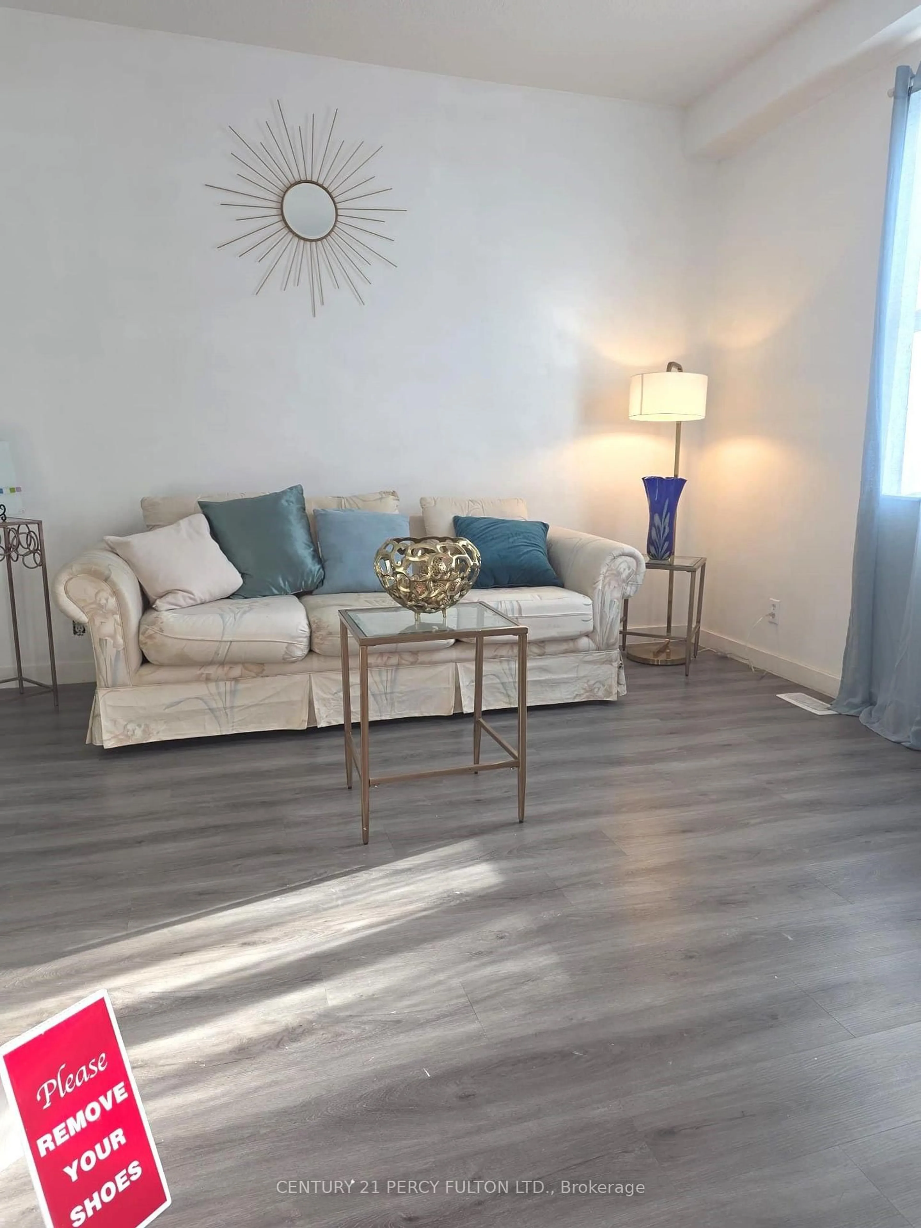 Living room with furniture, wood/laminate floor for 130 Stirton St, Hamilton Ontario L8L 6G2