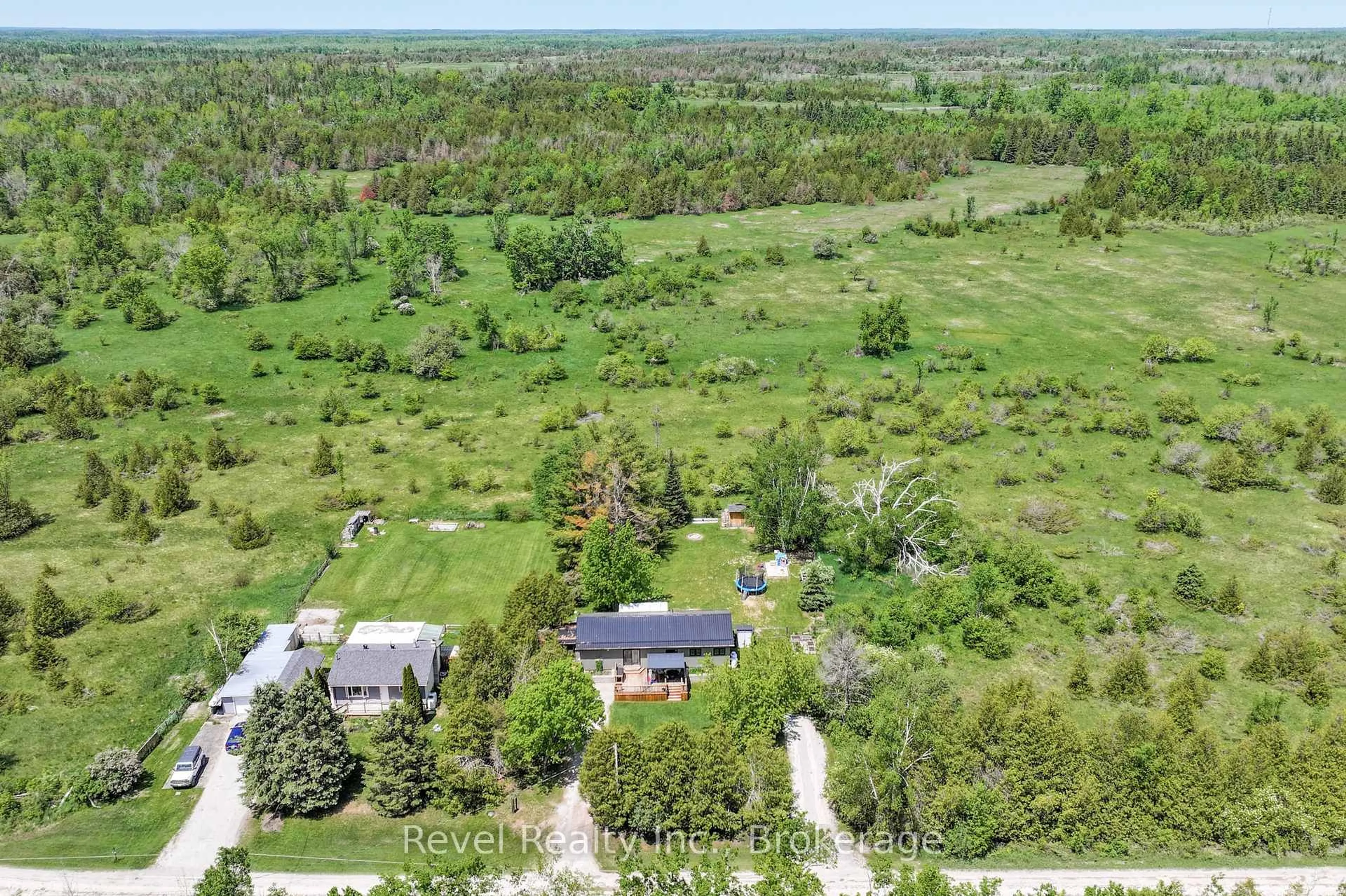 A pic from outside/outdoor area/front of a property/back of a property/a pic from drone, forest/trees view for 122 Mcguire Beach Rd, Kawartha Lakes Ontario K0M 2B0