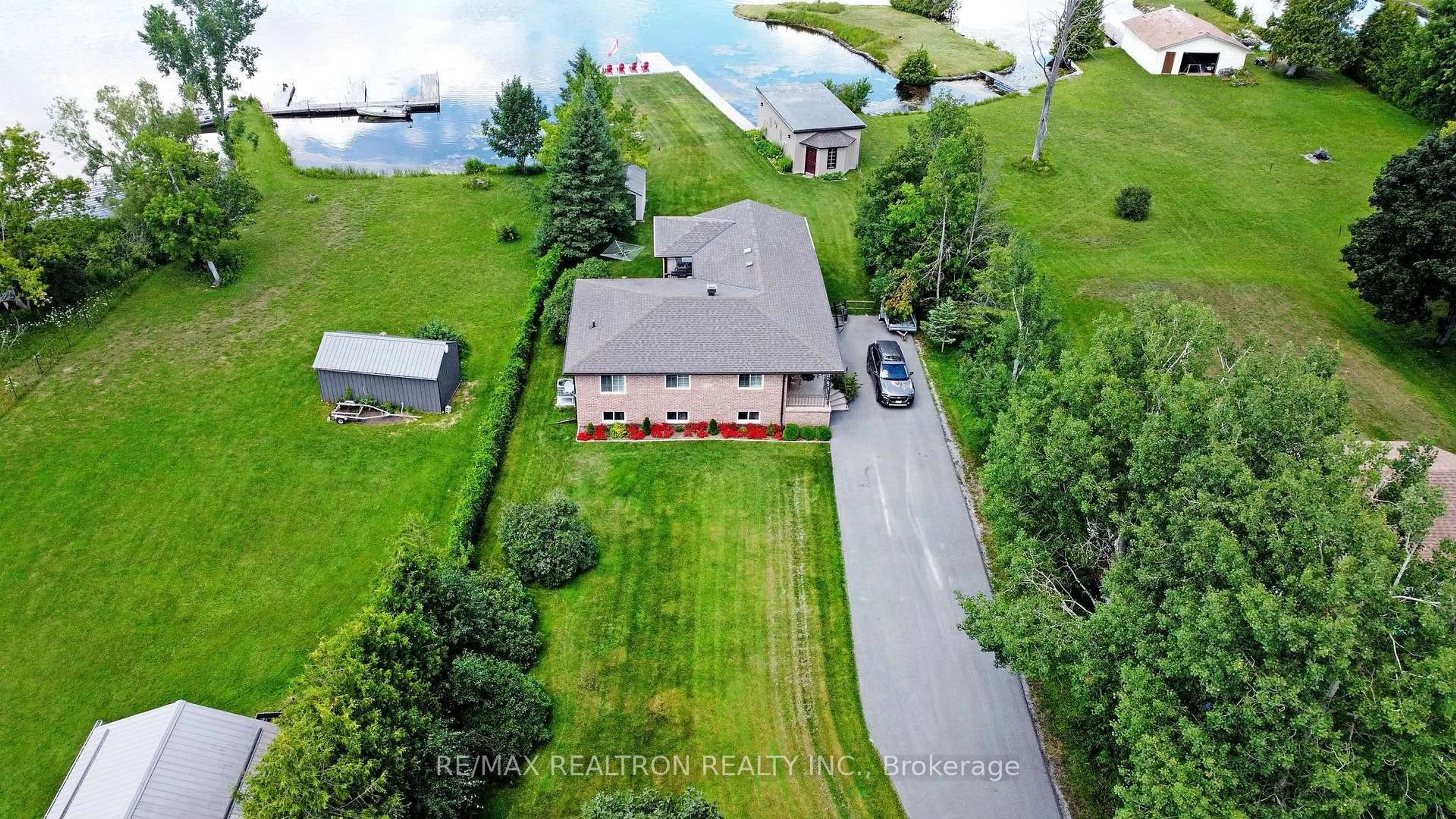A pic from outside/outdoor area/front of a property/back of a property/a pic from drone, water/lake/river/ocean view for 53 Robinson Ave, Kawartha Lakes Ontario K0M 2B0