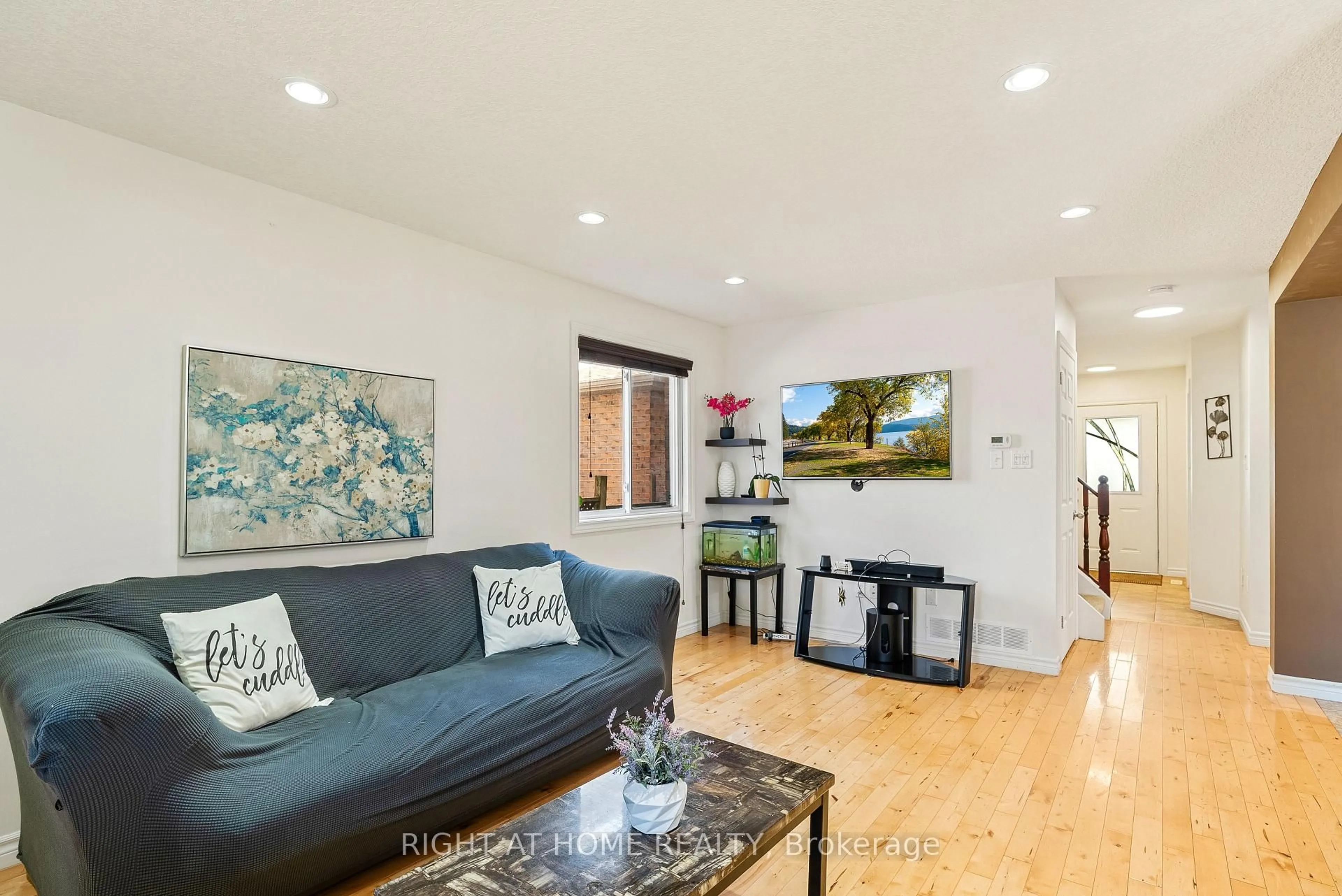 Living room with furniture, wood/laminate floor for 1460 South Wenige Dr, London North Ontario N5X 4N1
