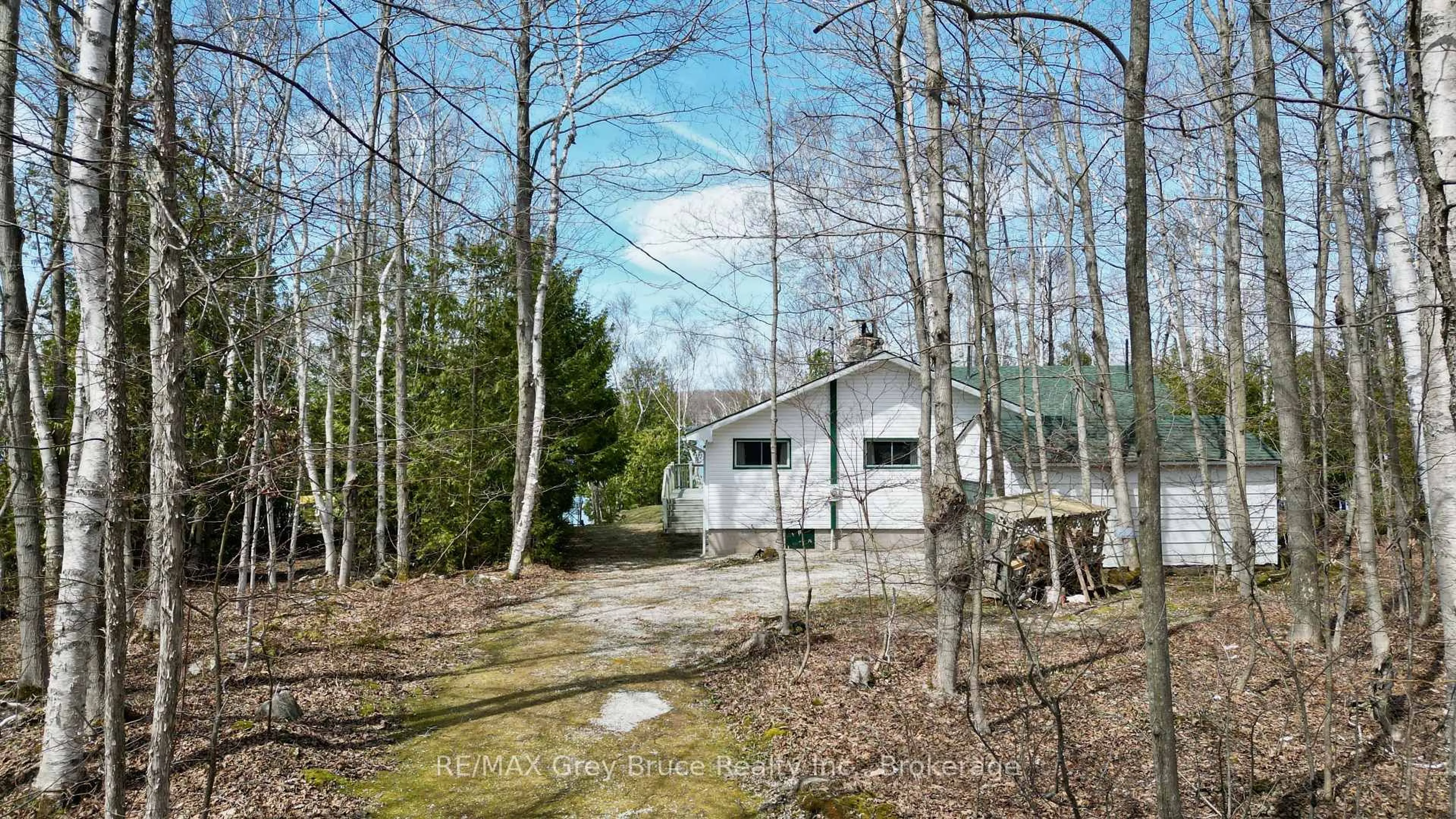 A pic from outside/outdoor area/front of a property/back of a property/a pic from drone, forest/trees view for 294 Tammy's Cove Rd, Northern Bruce Peninsula Ontario N0H 1W0