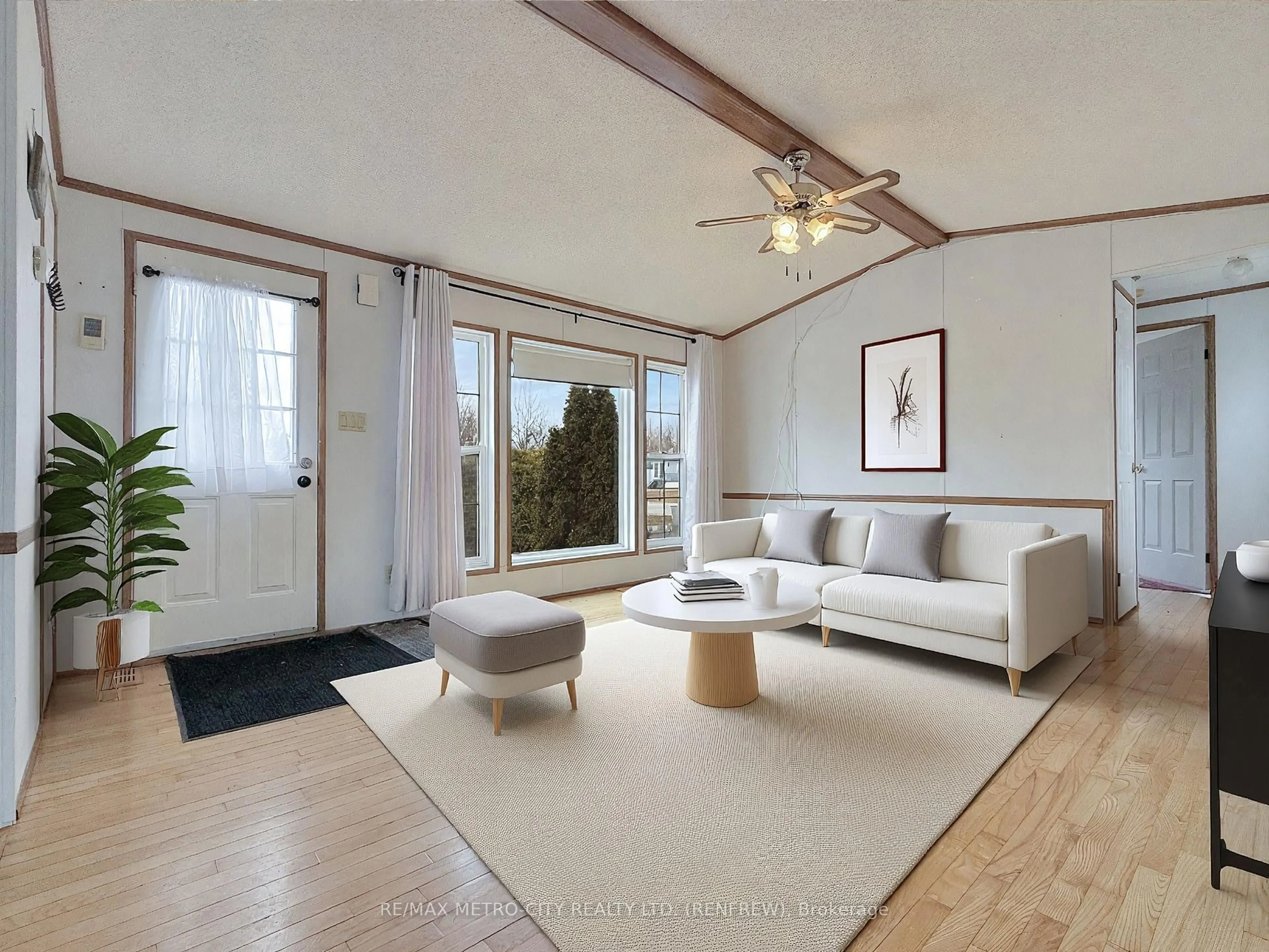Living room with furniture, wood/laminate floor for 34 SUNSET Lane, Renfrew Ontario K7V 0A5