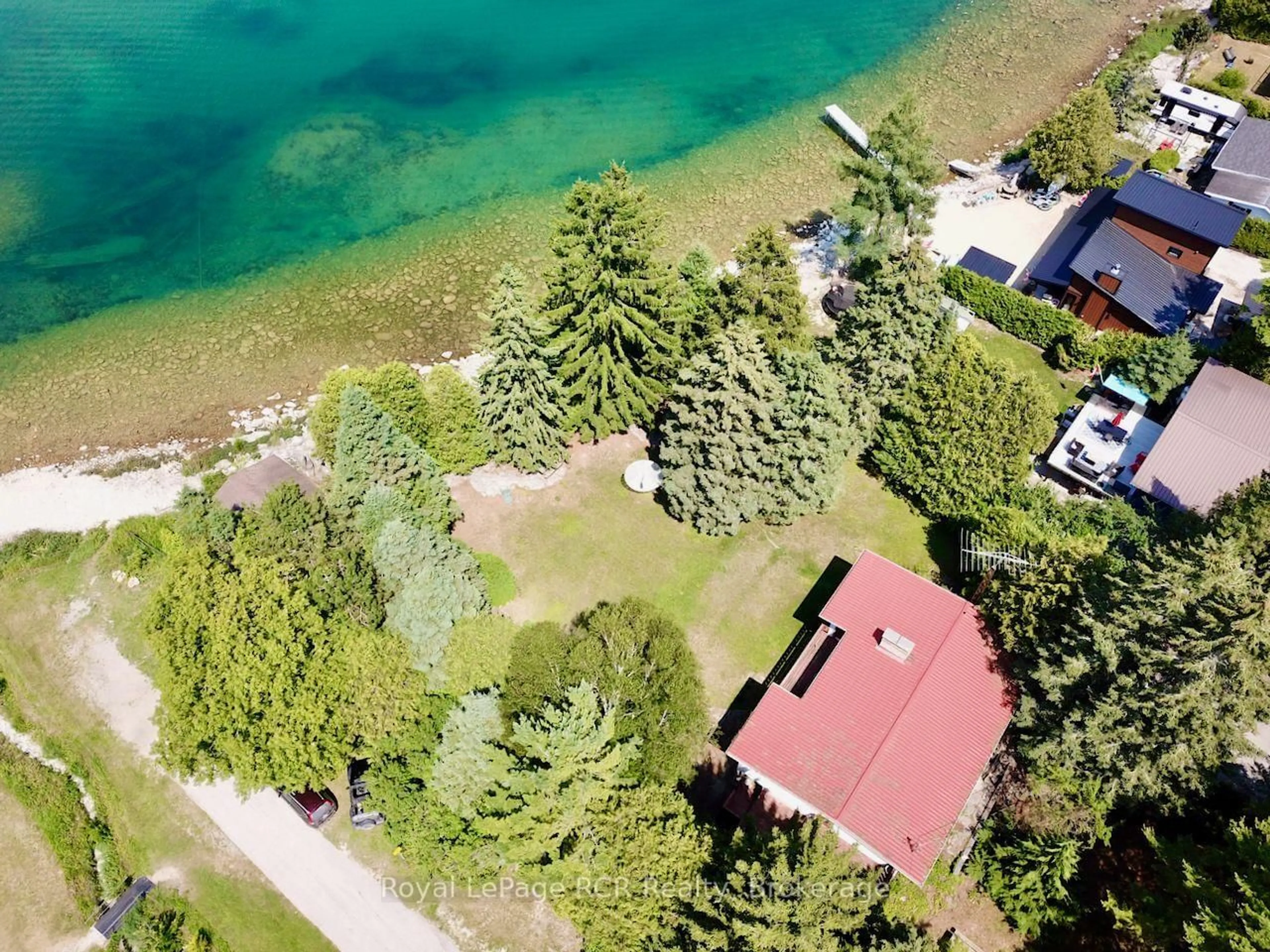 A pic from outside/outdoor area/front of a property/back of a property/a pic from drone, water/lake/river/ocean view for 2 William St, Northern Bruce Peninsula Ontario N0H 1W0
