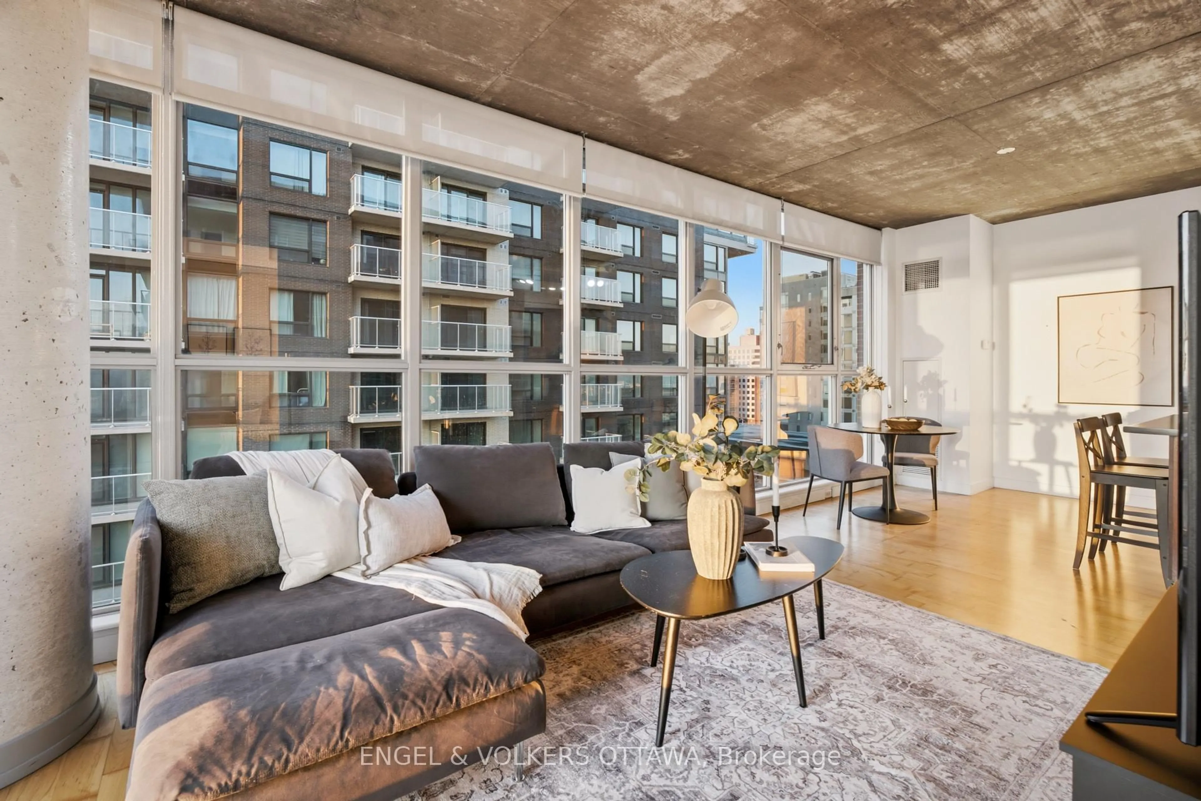Living room with furniture, cement floor for 179 George St #1903, Ottawa Ontario K1N 1J8
