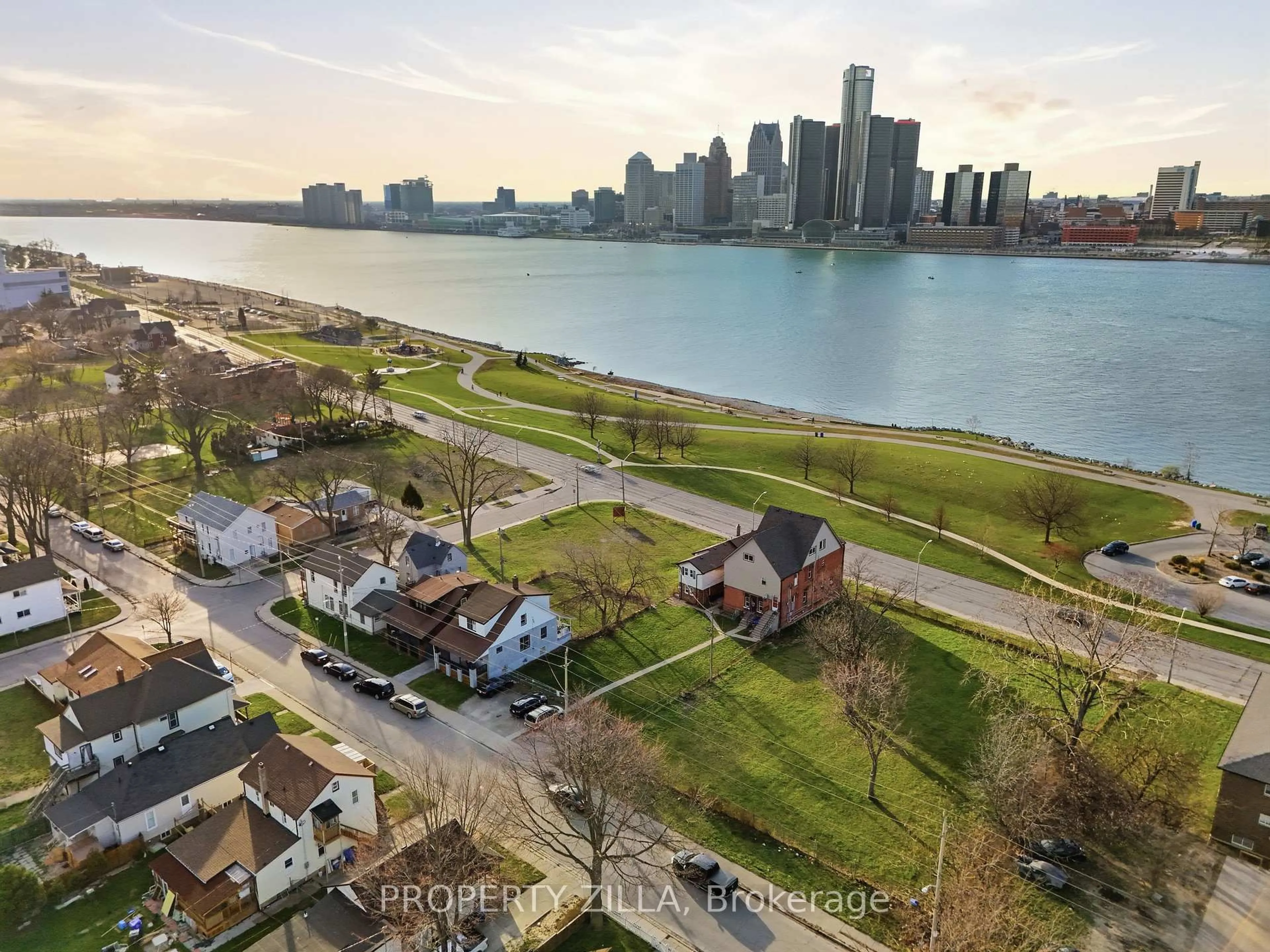 A pic from outside/outdoor area/front of a property/back of a property/a pic from drone, water/lake/river/ocean view for 819-829 RIVERSIDE Dr, Windsor Ontario N9A 2T4