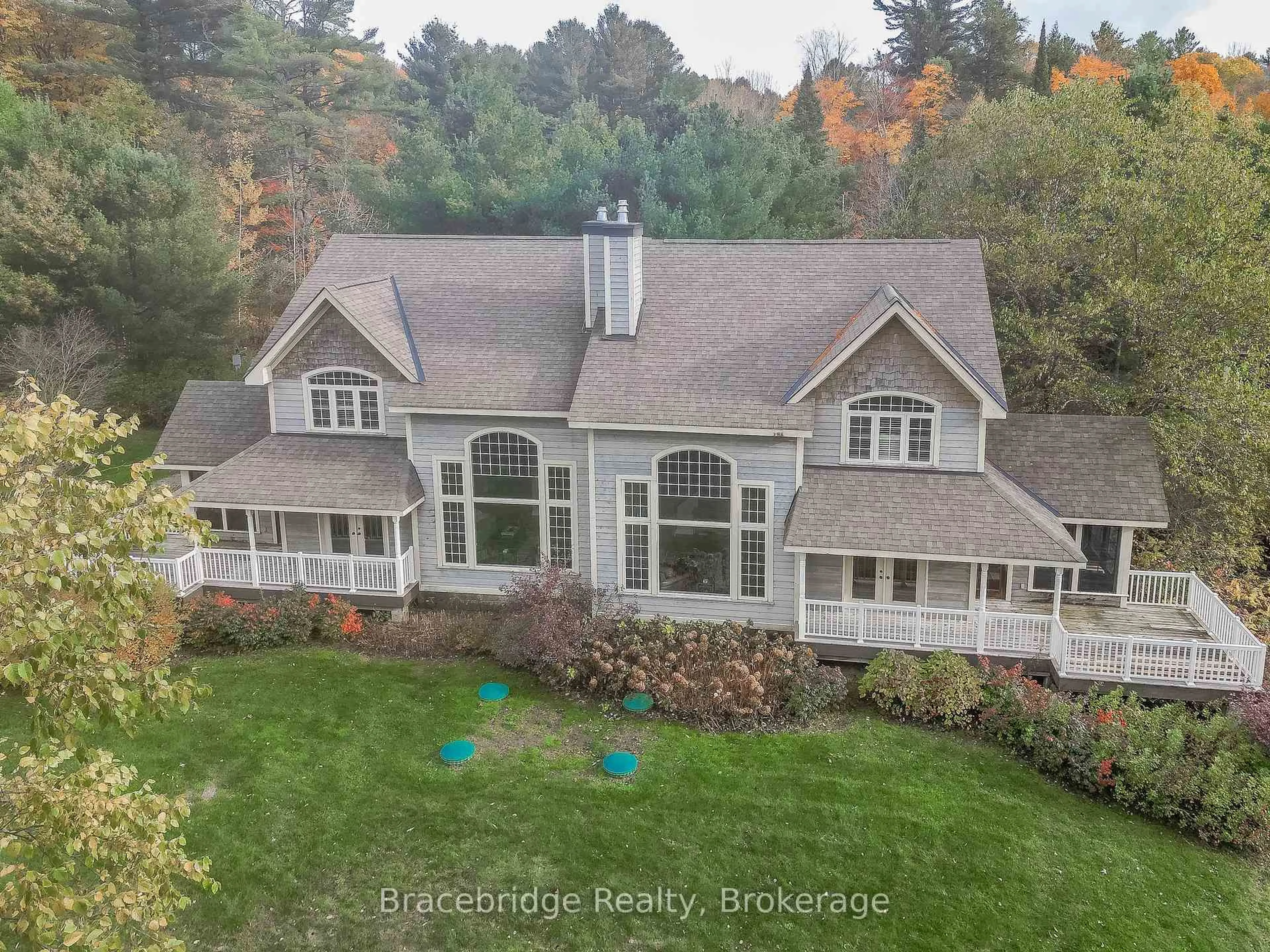 A pic from outside/outdoor area/front of a property/back of a property/a pic from drone, mountain view for 3876 Muskoka Rd 118 Highway #Carling 6 W2, Muskoka Lakes Ontario P0B 1J0