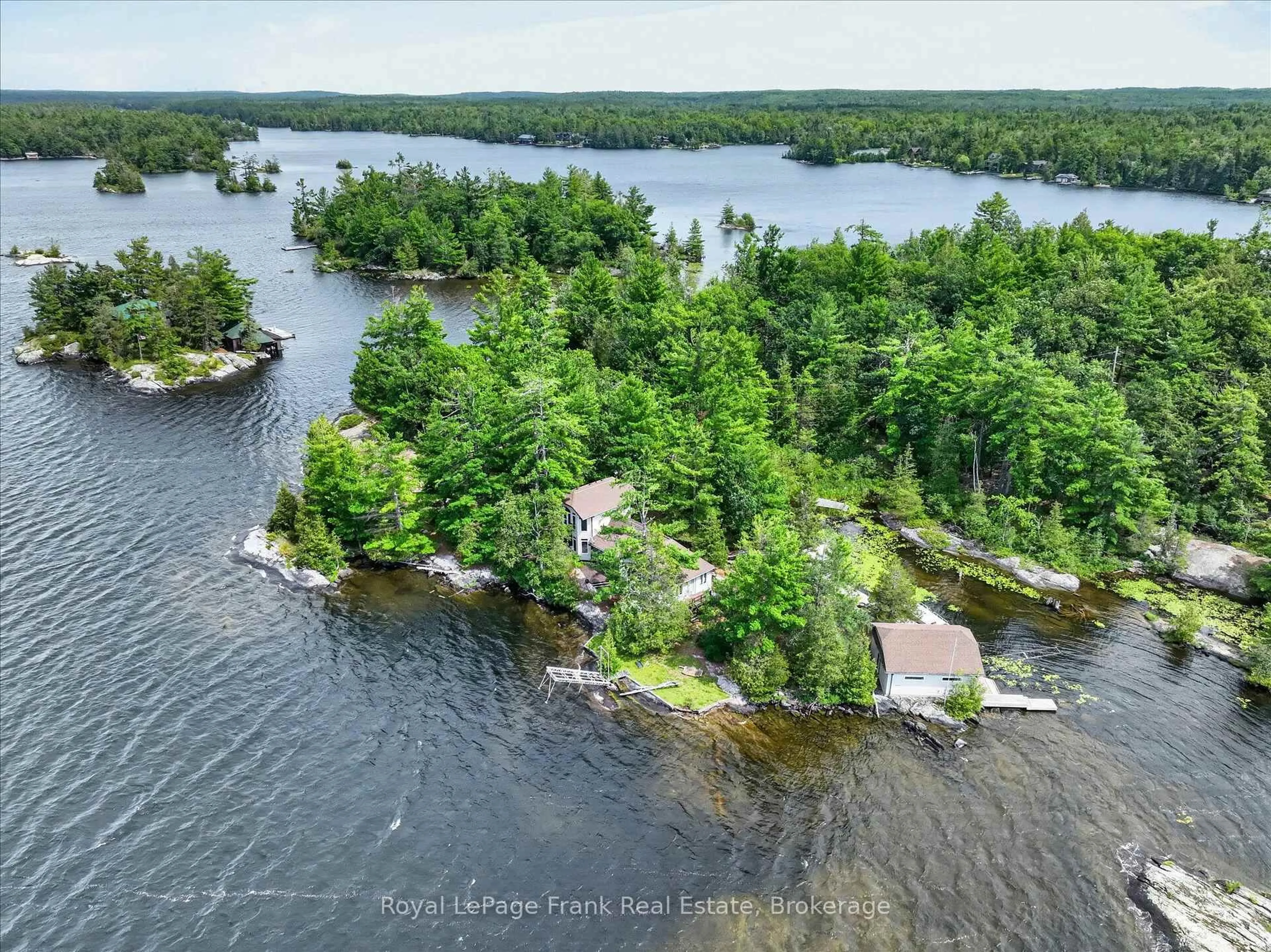 A pic from outside/outdoor area/front of a property/back of a property/a pic from drone, water/lake/river/ocean view for 1550 Island 85 Stoney Lake, Douro-Dummer Ontario K0L 2H0