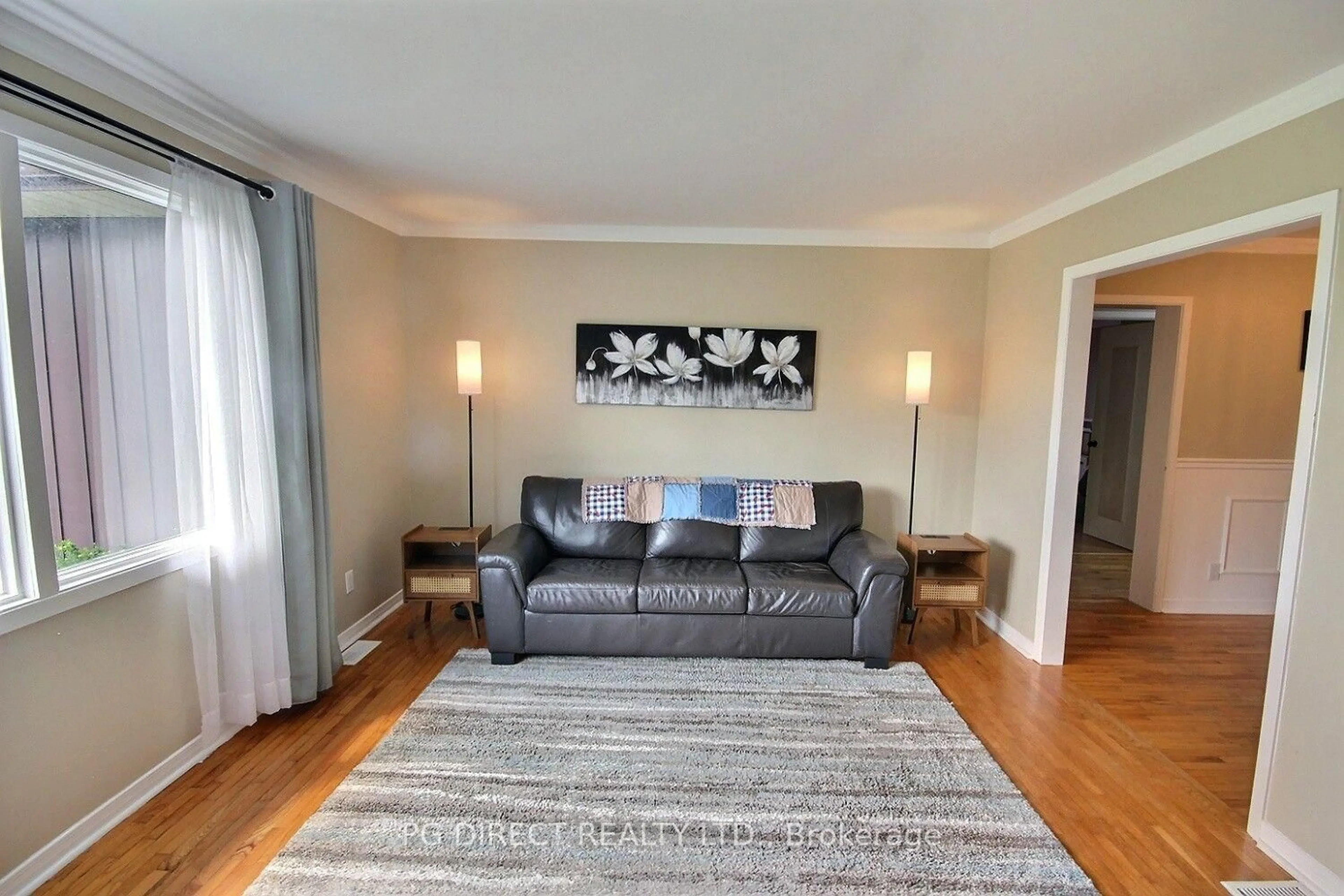 Living room with furniture, wood/laminate floor for 2402 Hamilton Rd, Trenton Ontario K8V 5P8