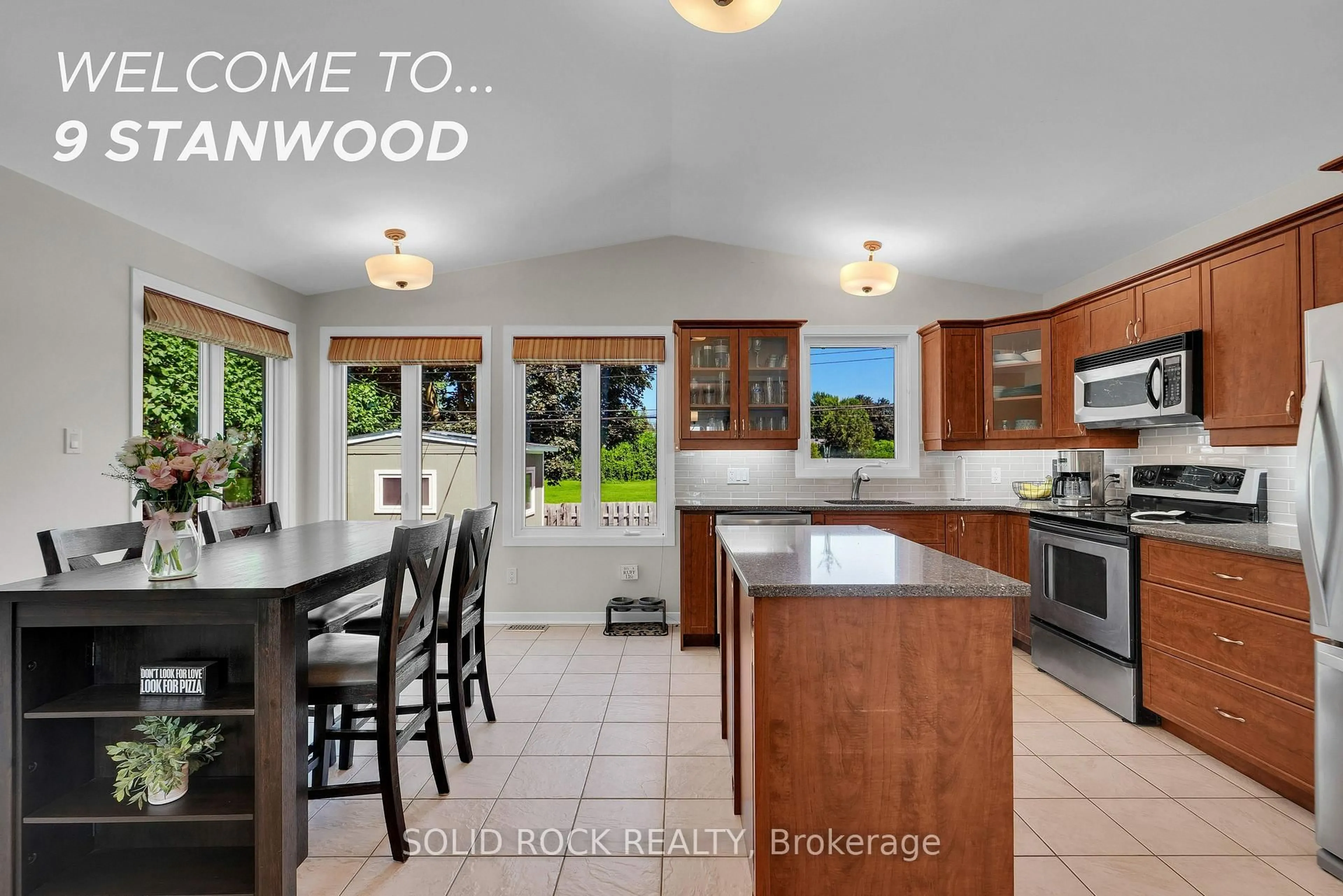 Open concept kitchen, wood/laminate floor for 9 Stanwood Dr, Ottawa Ontario K2G 2Z1