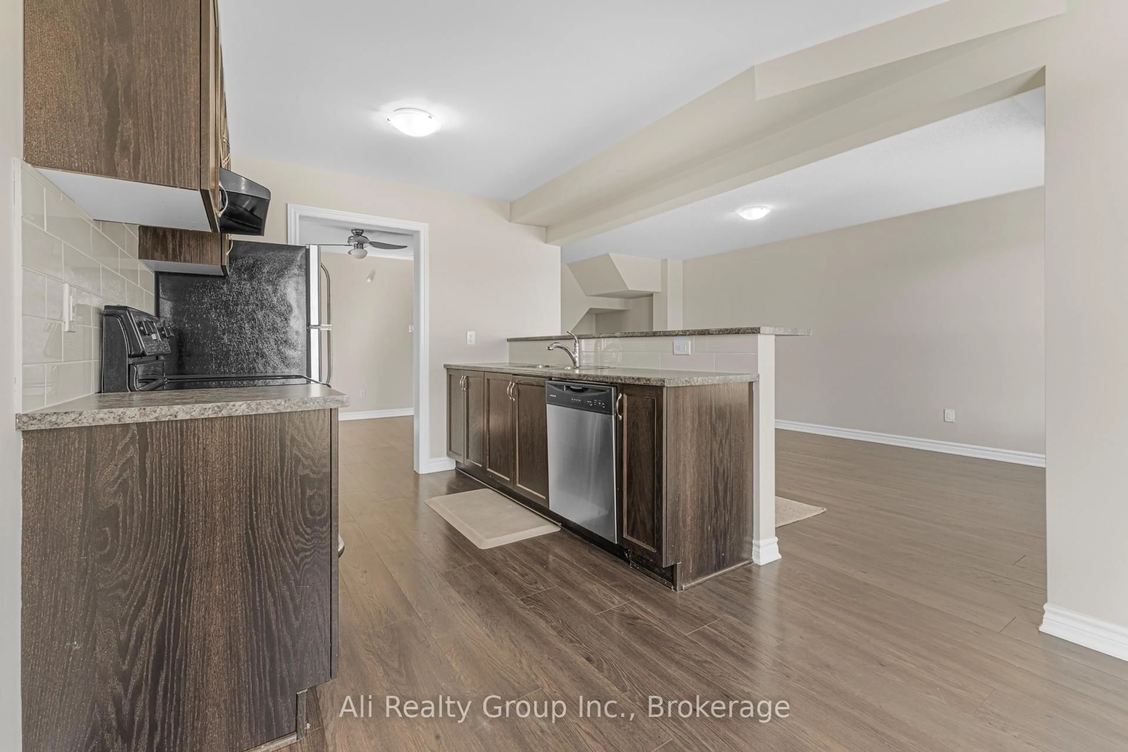 Open concept kitchen, wood/laminate floor for 359 Sweetfern Cres, Ottawa Ontario K4A 1A5