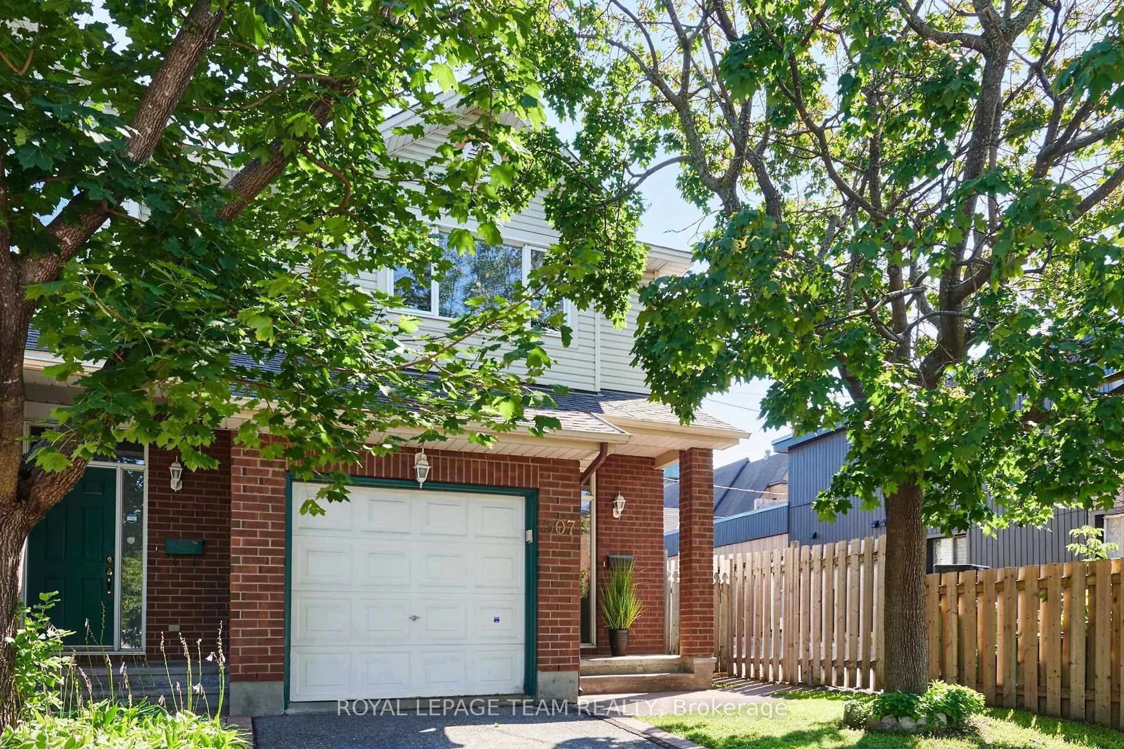 Home with brick exterior material, street for 307 Cyr Ave, Ottawa Ontario K1L 7N6