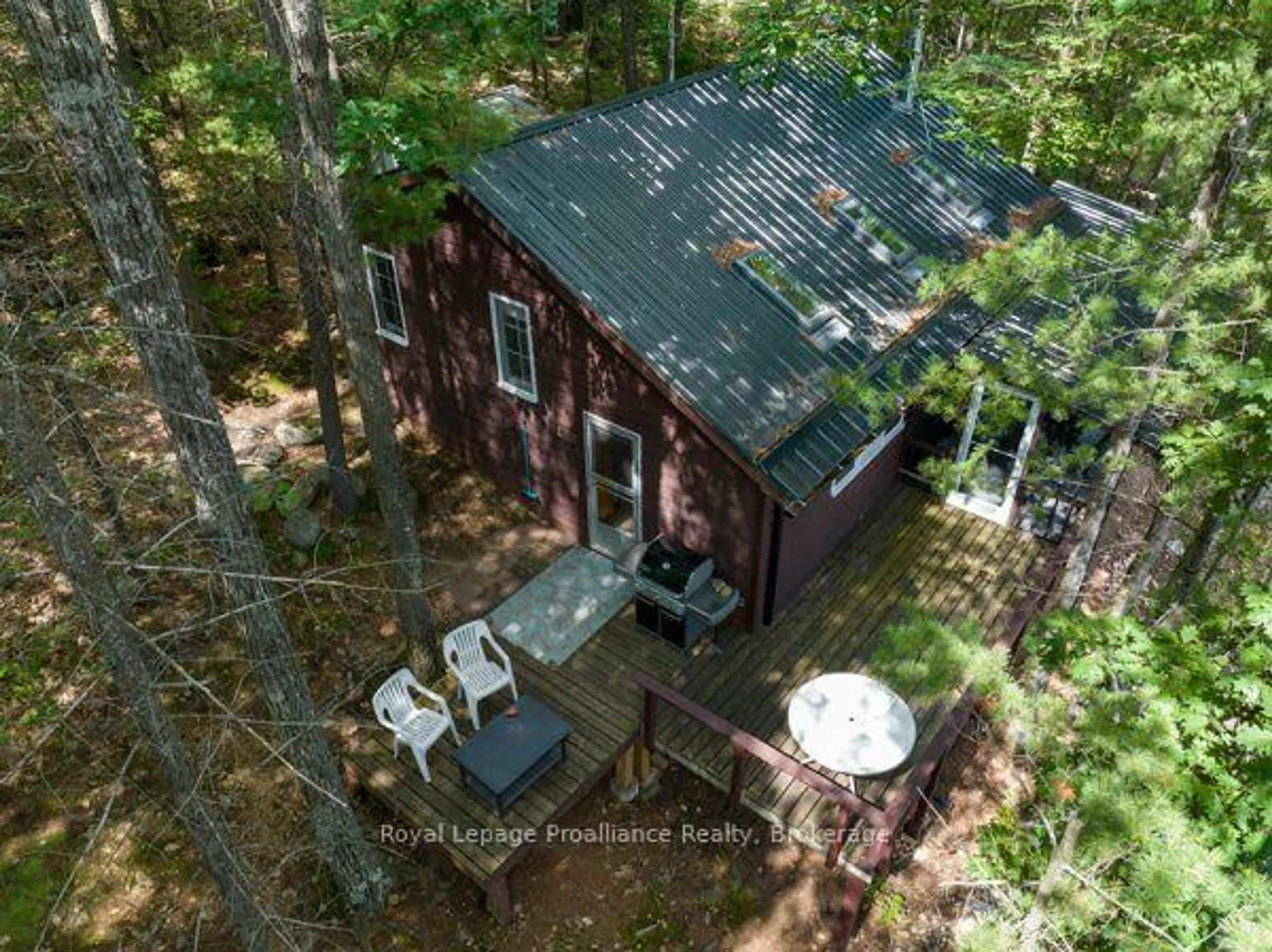 A pic from outside/outdoor area/front of a property/back of a property/a pic from drone, forest/trees view for 406 Mazinaw Lake Rd, Brighton Ontario K0K 1H0