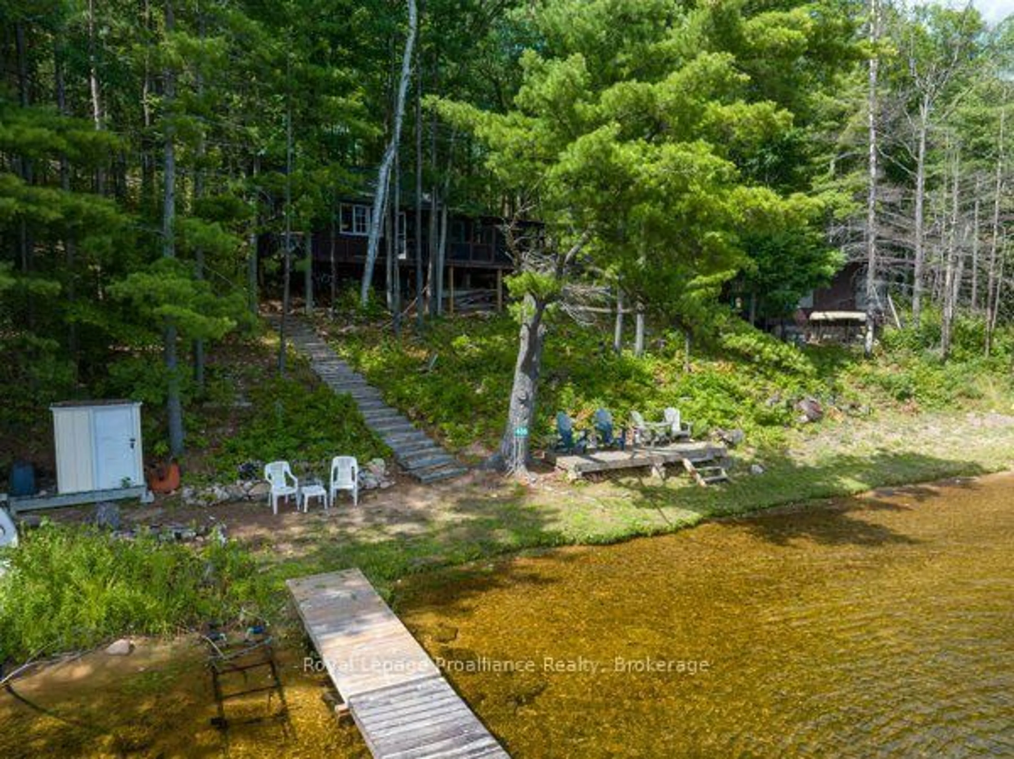 A pic from outside/outdoor area/front of a property/back of a property/a pic from drone, water/lake/river/ocean view for 406 Mazinaw Lake Rd, Brighton Ontario K0K 1H0