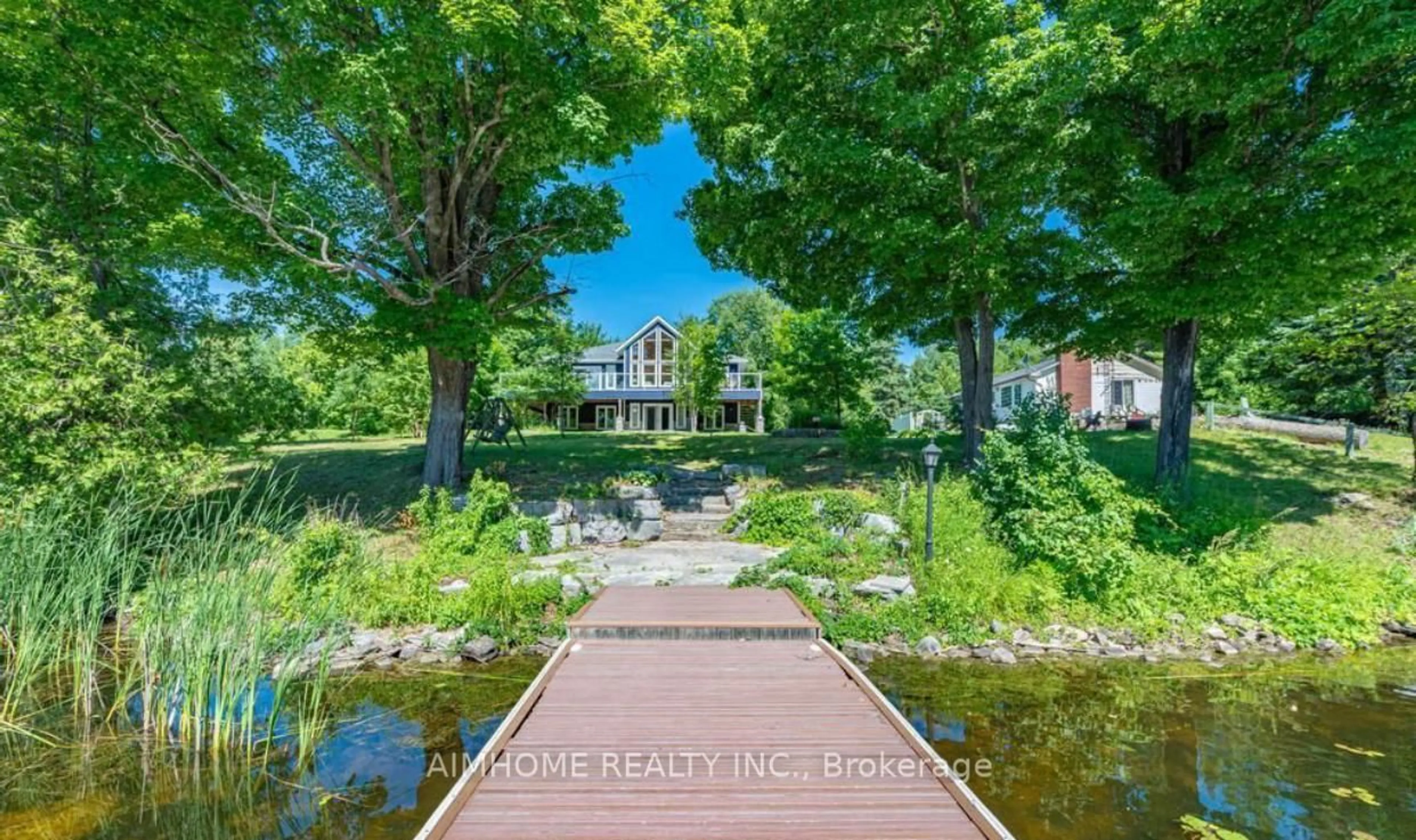 A pic from outside/outdoor area/front of a property/back of a property/a pic from drone, water/lake/river/ocean view for 62 Fire Route 94, Trent Lakes Ontario K0M 1A0