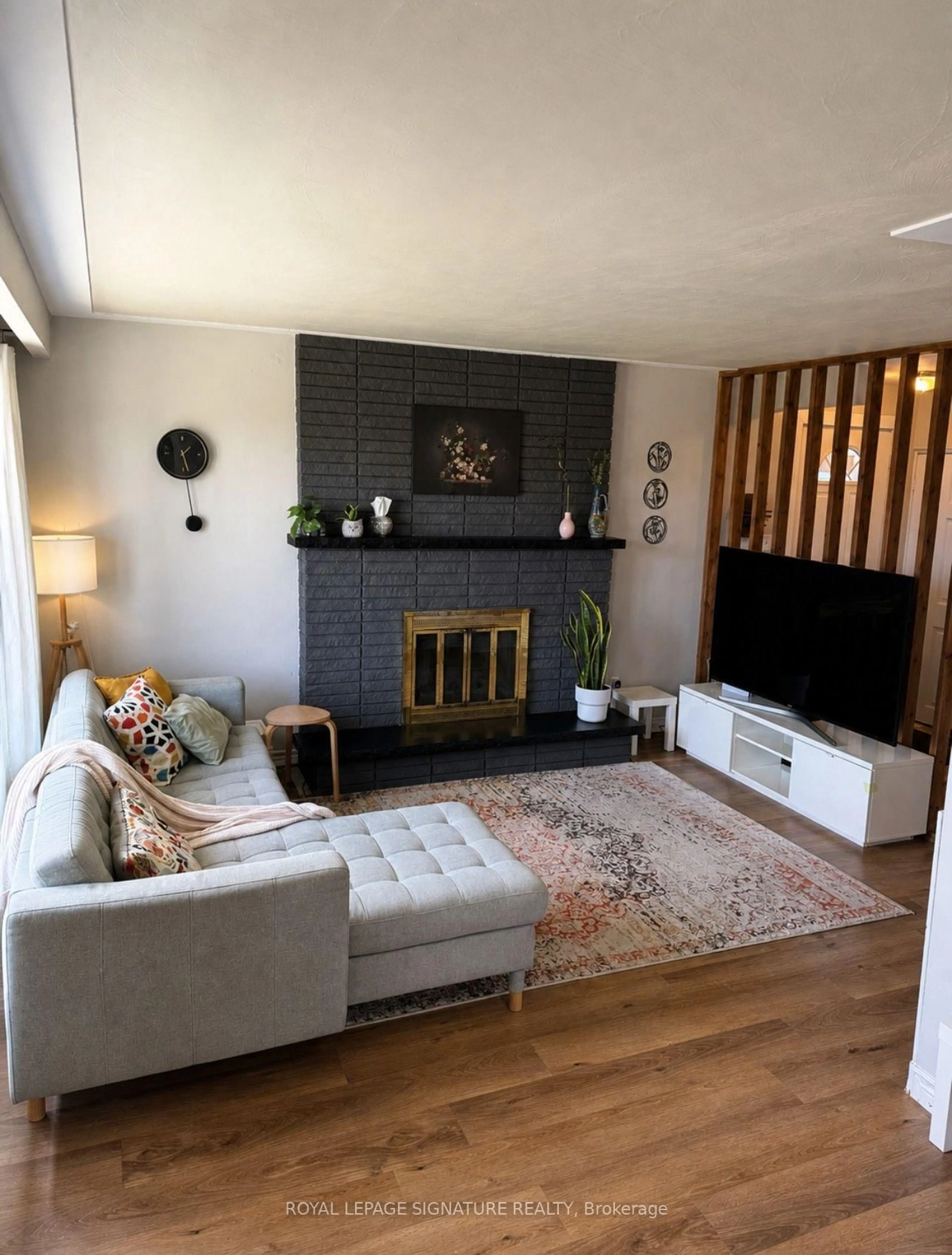 Living room with furniture, wood/laminate floor for 66 Victor Blvd, Hamilton Ontario L9A 2V4