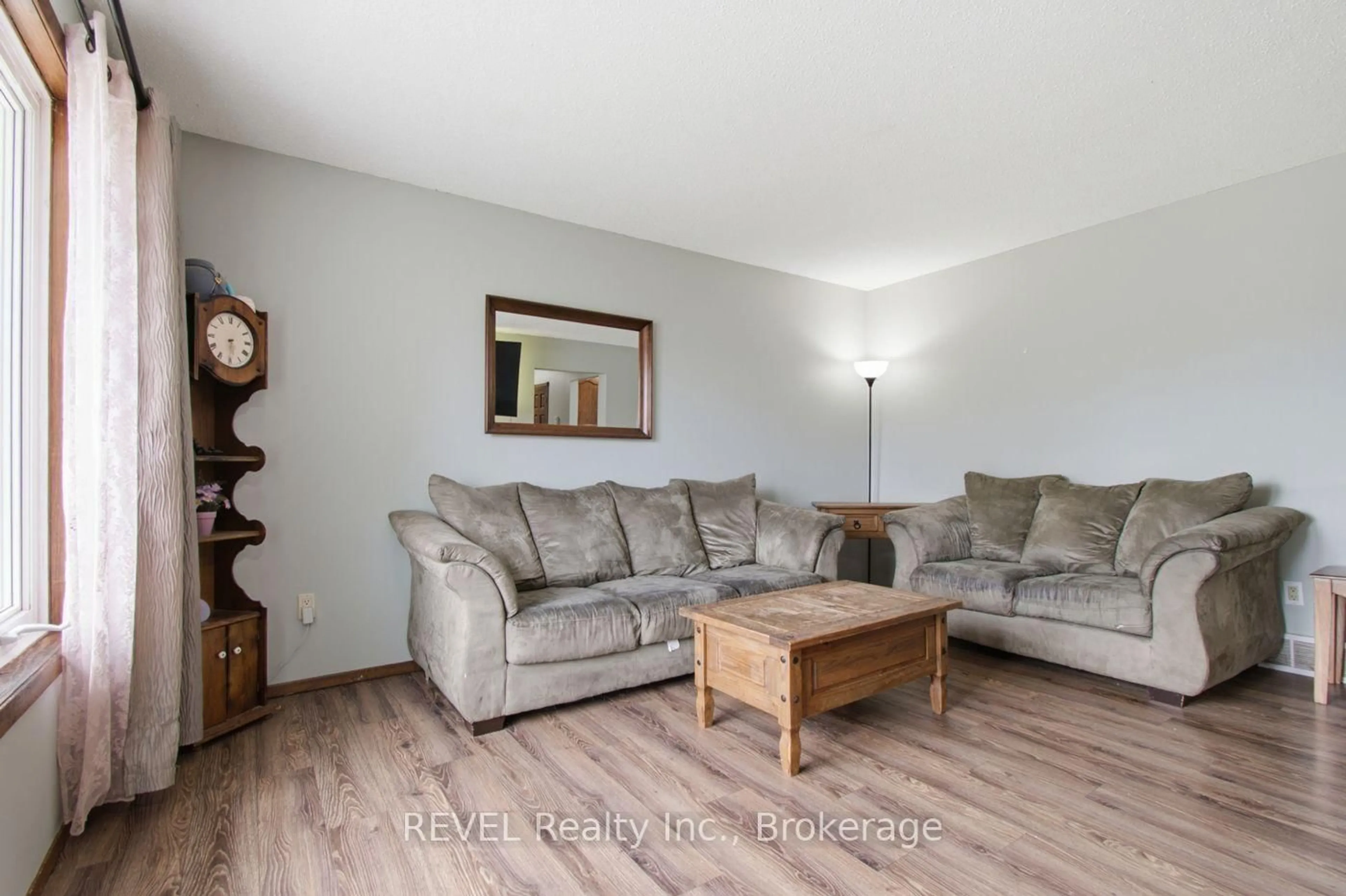 Living room with furniture, wood/laminate floor for 2203 STEVENSVILLE Rd, Fort Erie Ontario L0S 1S0