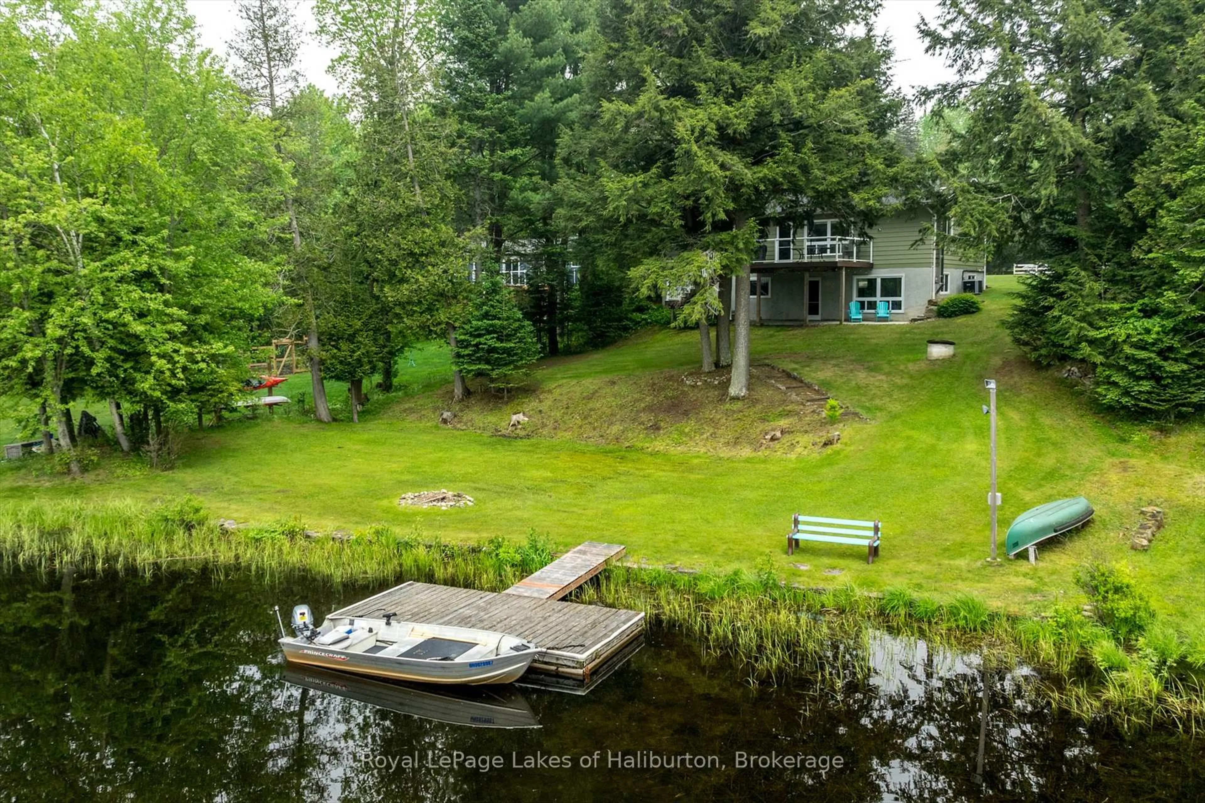 A pic from outside/outdoor area/front of a property/back of a property/a pic from drone, water/lake/river/ocean view for 1093 Lamar Dr, Algonquin Highlands Ontario K0M 1S0