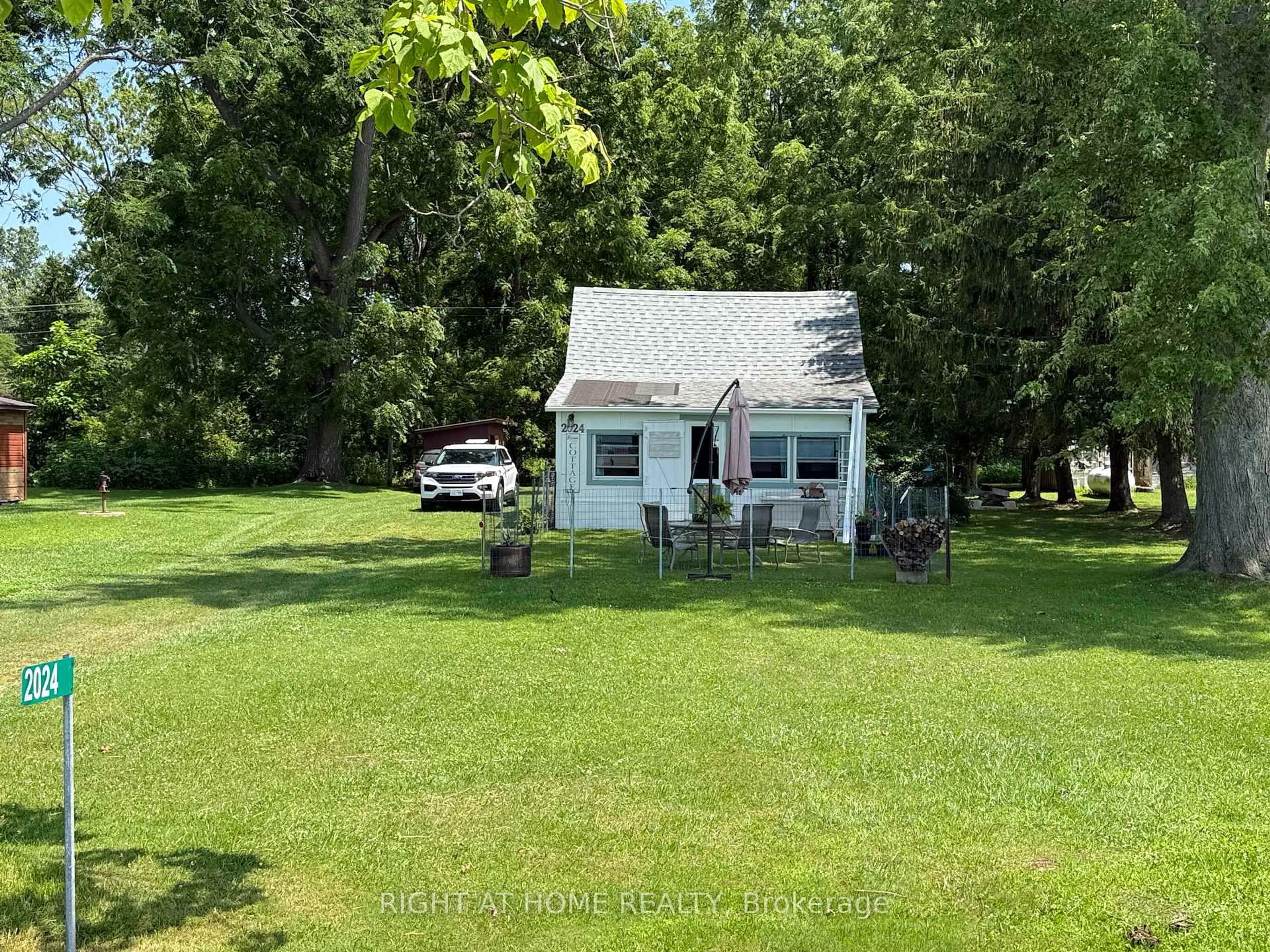 A pic from outside/outdoor area/front of a property/back of a property/a pic from drone, water/lake/river/ocean view for 2024 River Rd, Chatham-Kent Ontario N8A 4K9