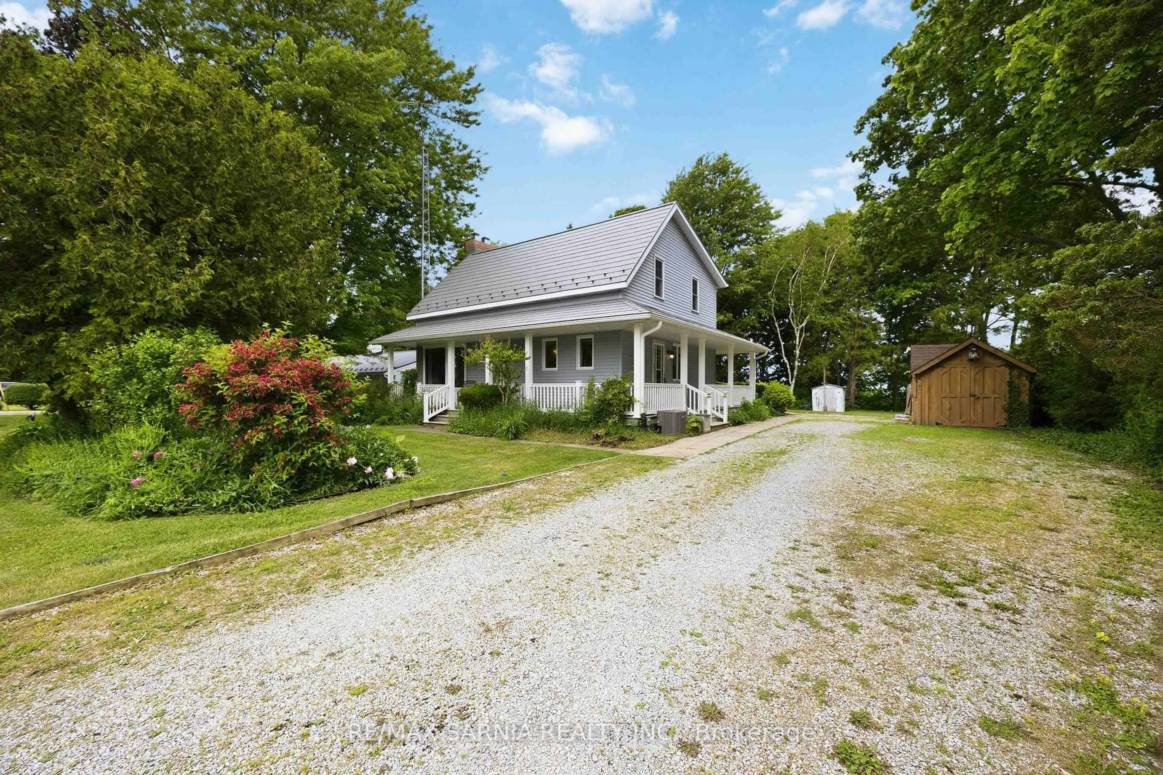A pic from outside/outdoor area/front of a property/back of a property/a pic from drone, street for 4656 Lakeside St, Plympton-Wyoming Ontario N0N 1J0