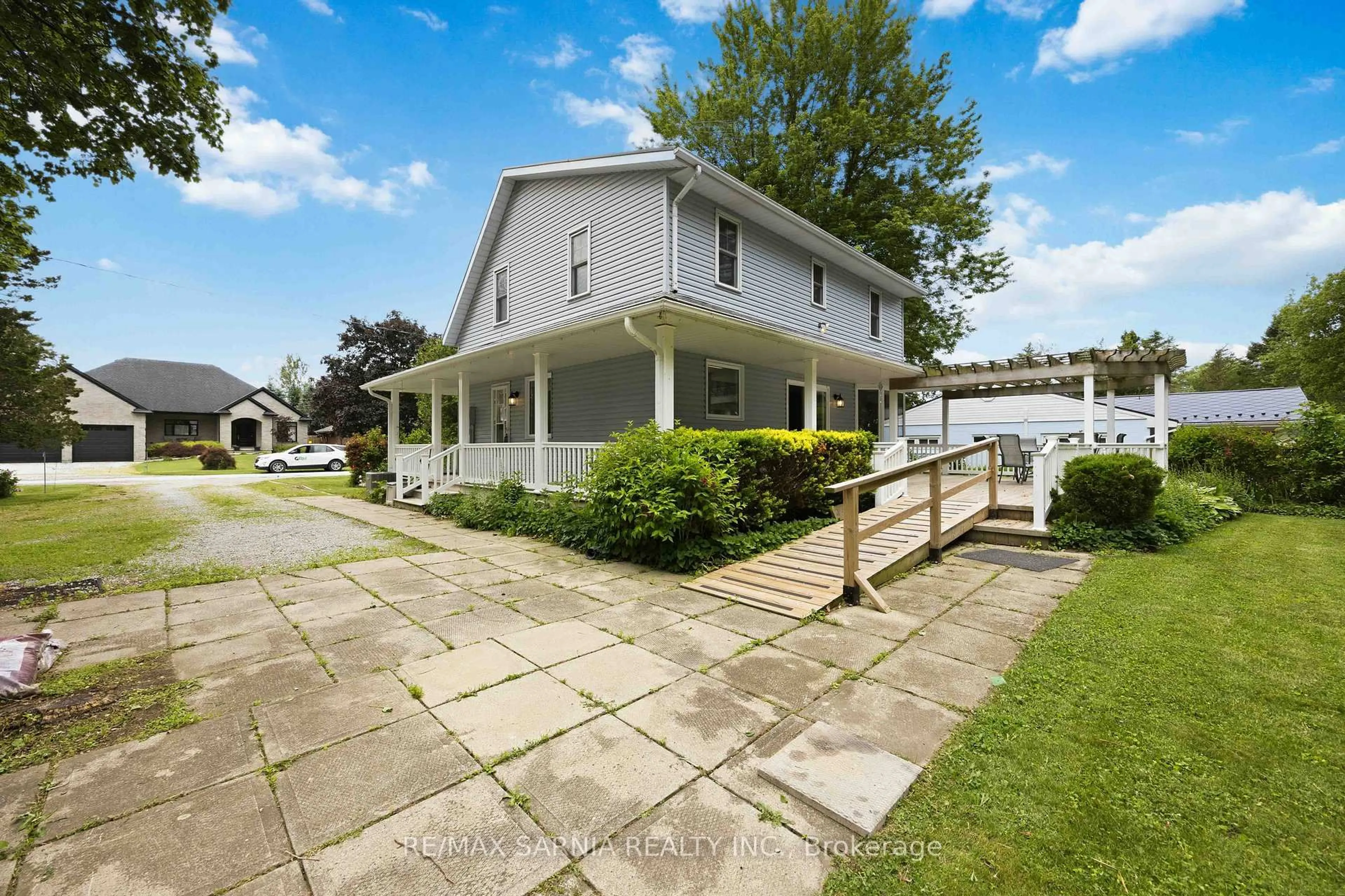 A pic from outside/outdoor area/front of a property/back of a property/a pic from drone, street for 4656 Lakeside St, Plympton-Wyoming Ontario N0N 1J0