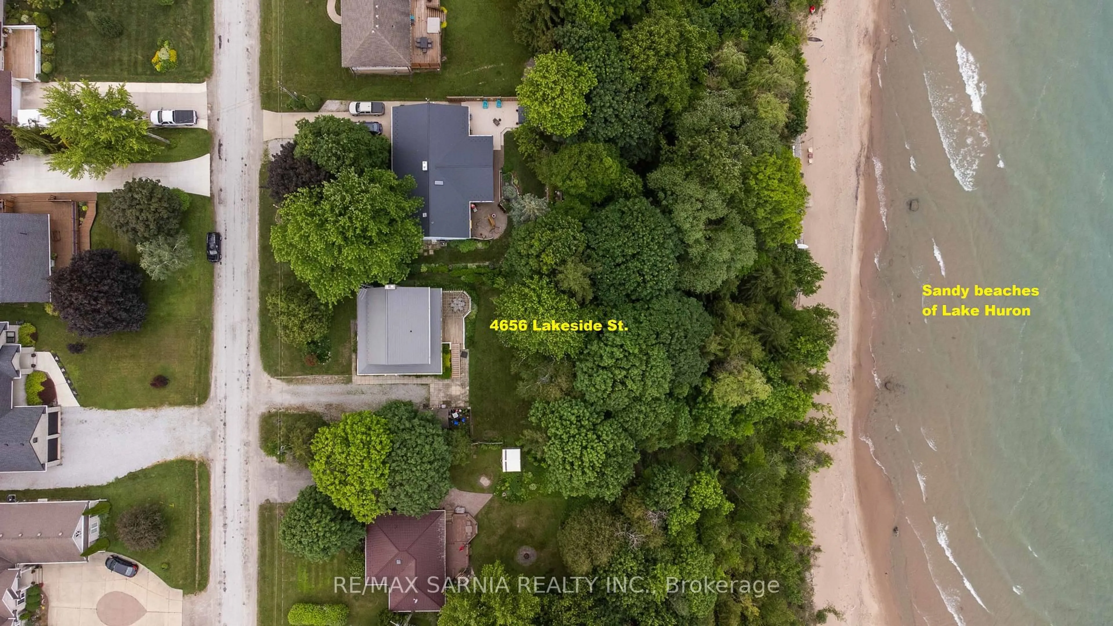 A pic from outside/outdoor area/front of a property/back of a property/a pic from drone, street for 4656 Lakeside St, Plympton-Wyoming Ontario N0N 1J0