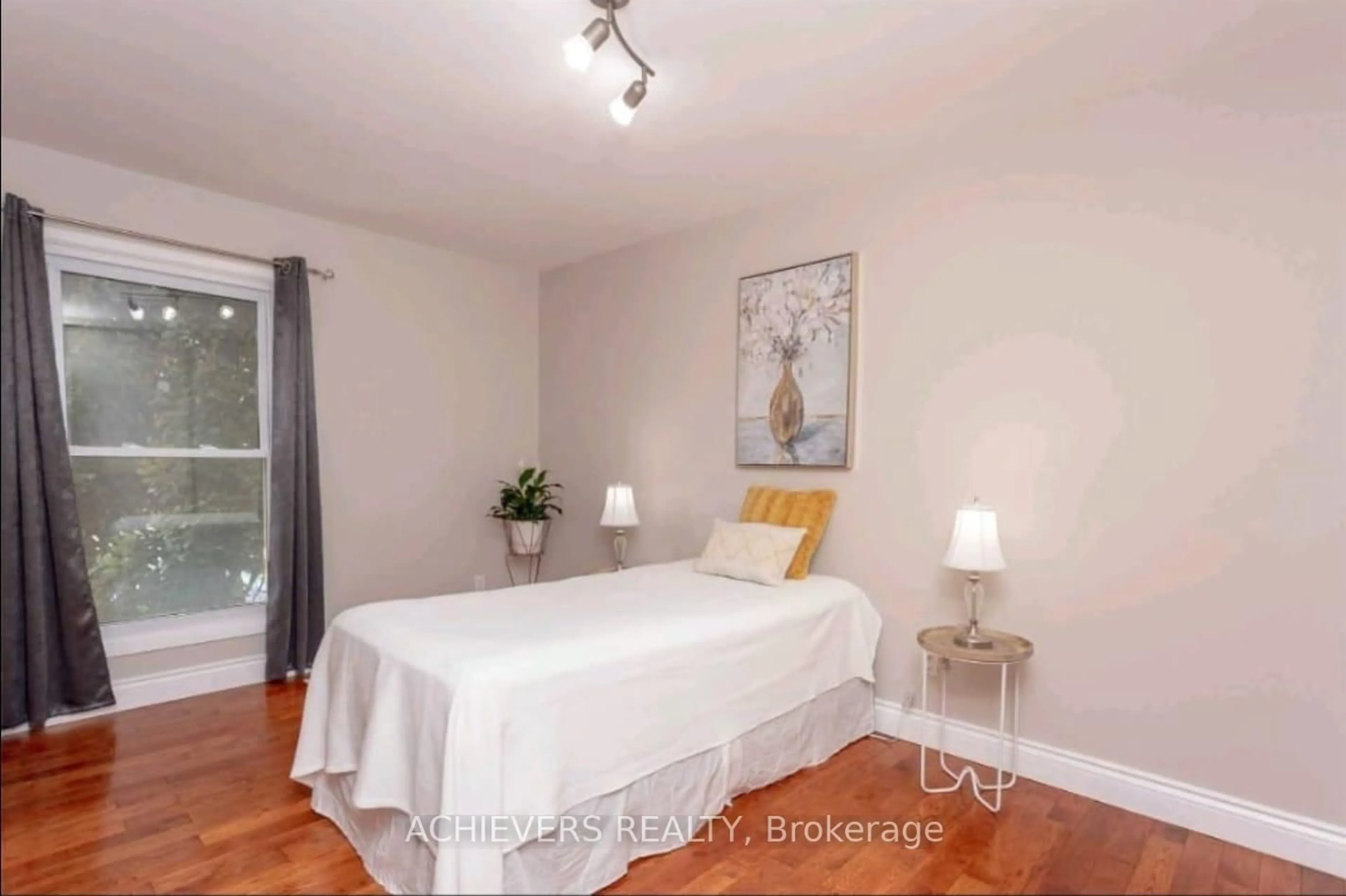 Bedroom with bed, wood/laminate floor for 770 Fanshawe Park Rd, London North Ontario N5X 1L5