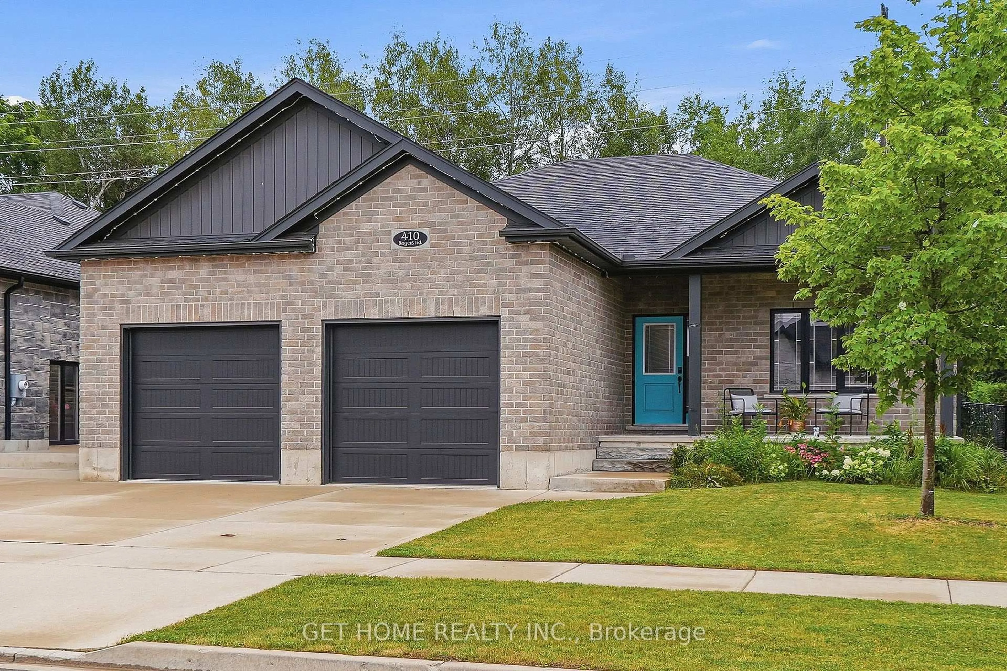 Home with brick exterior material, street for 410 Rogers Rd, North Perth Ontario N4W 0H2