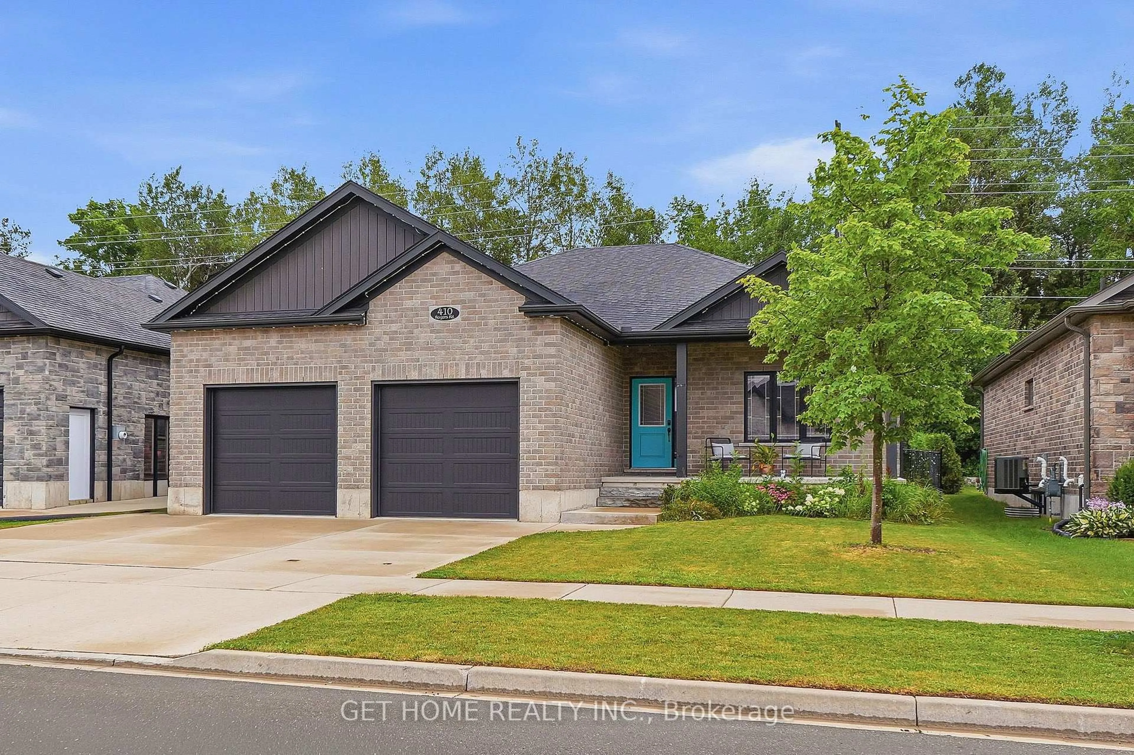 Home with brick exterior material, street for 410 Rogers Rd, North Perth Ontario N4W 0H2